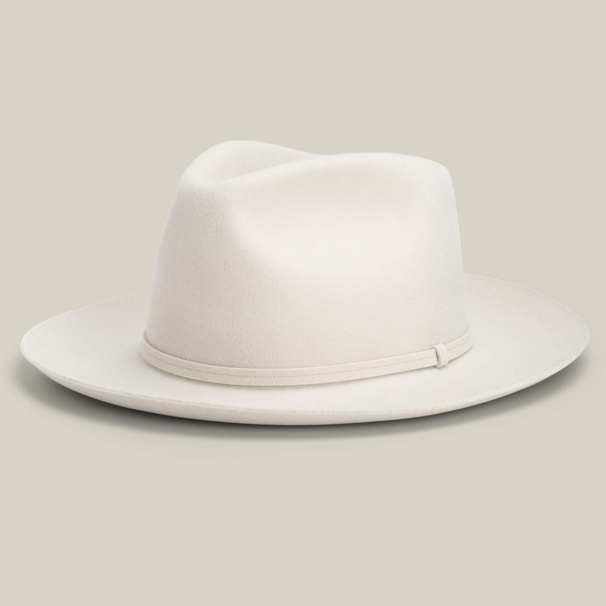The Goorin Bros. Night Hawk is a light beige teardrop crown fedora with a wide snap brim and simple matching band, shown against a plain background.
