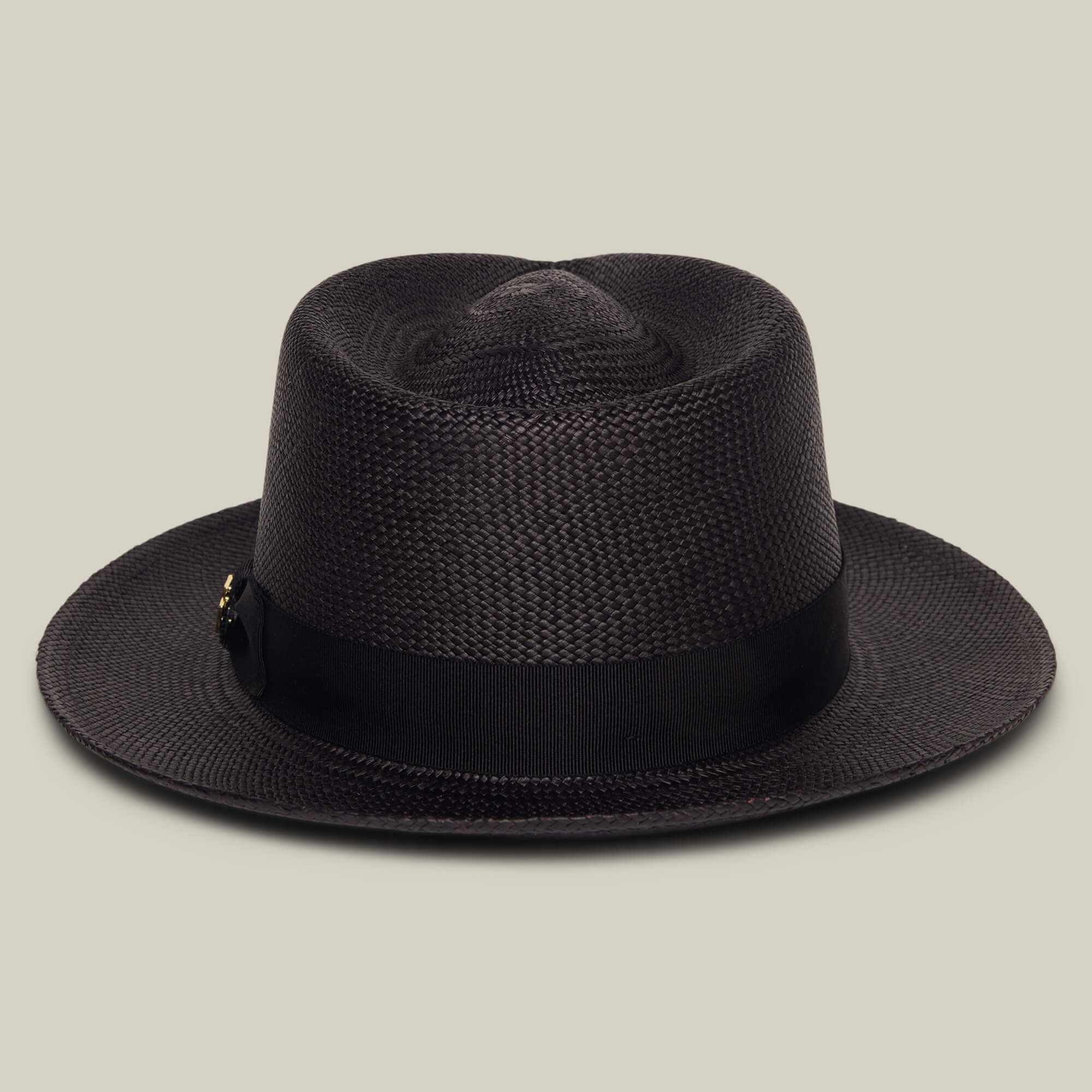The Goorin Bros. "John Sr." is a dark brown toquilla teardrop fedora hat with a black ribbon band and 50 UPF sun protection, shown against a plain beige background.