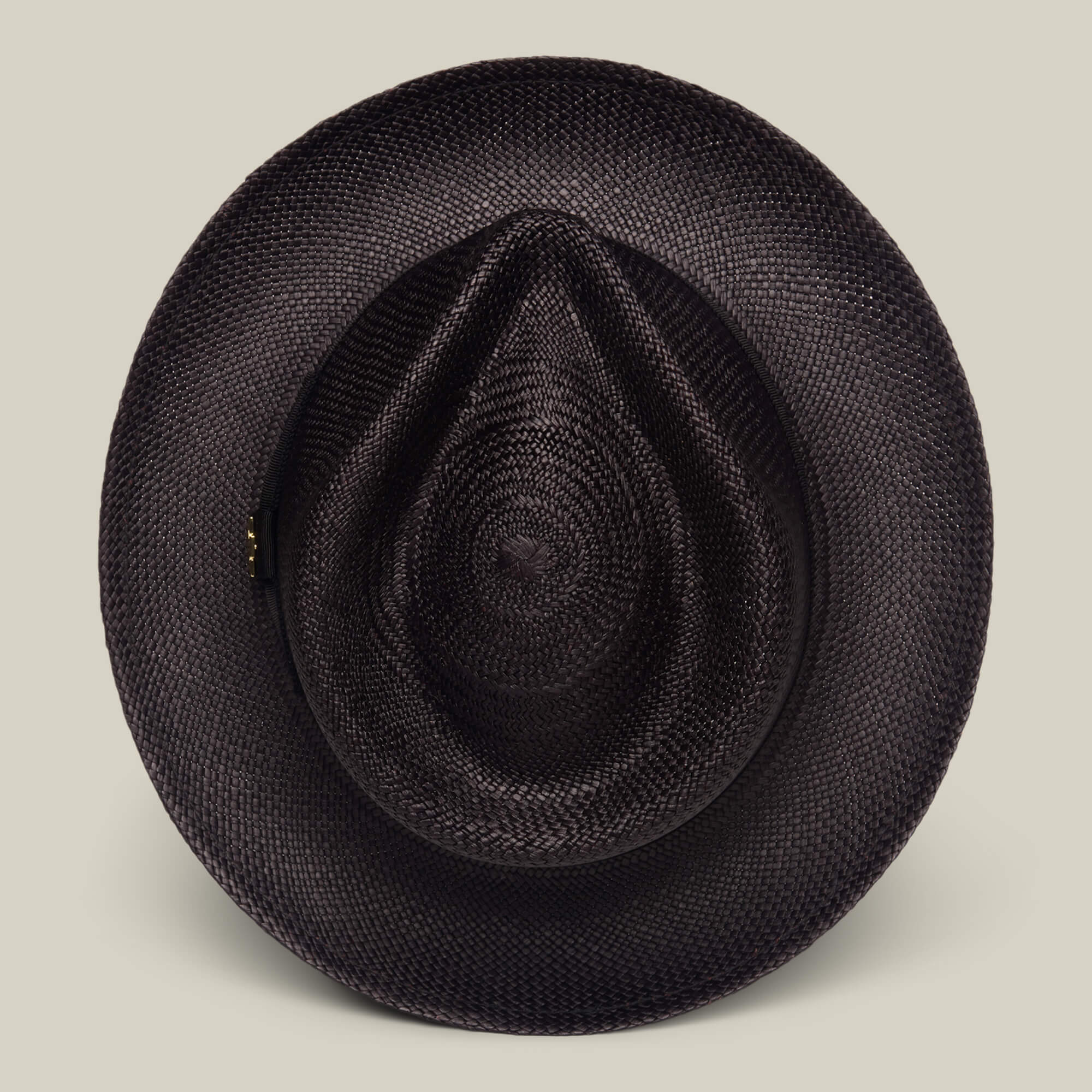 The John Sr. by Goorin Bros. is a black toquilla straw teardrop fedora with a wide brim, pointed crown, and 50 UPF sun protection, shown on a plain beige background.