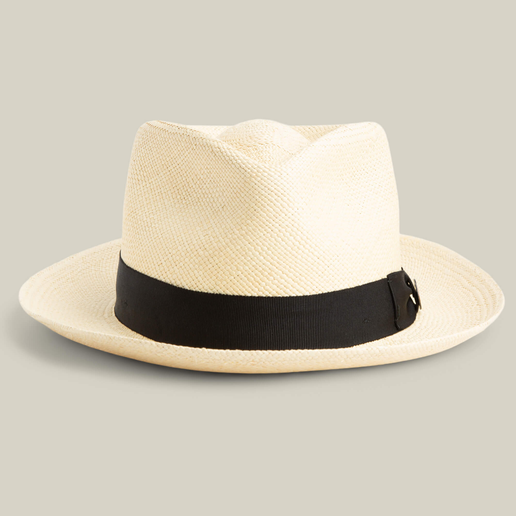 The Goorin Bros. John Sr. teardrop fedora in Natural features a wide black band with a small buckle, offers 50 UPF sun protection, and is displayed on a neutral background.
