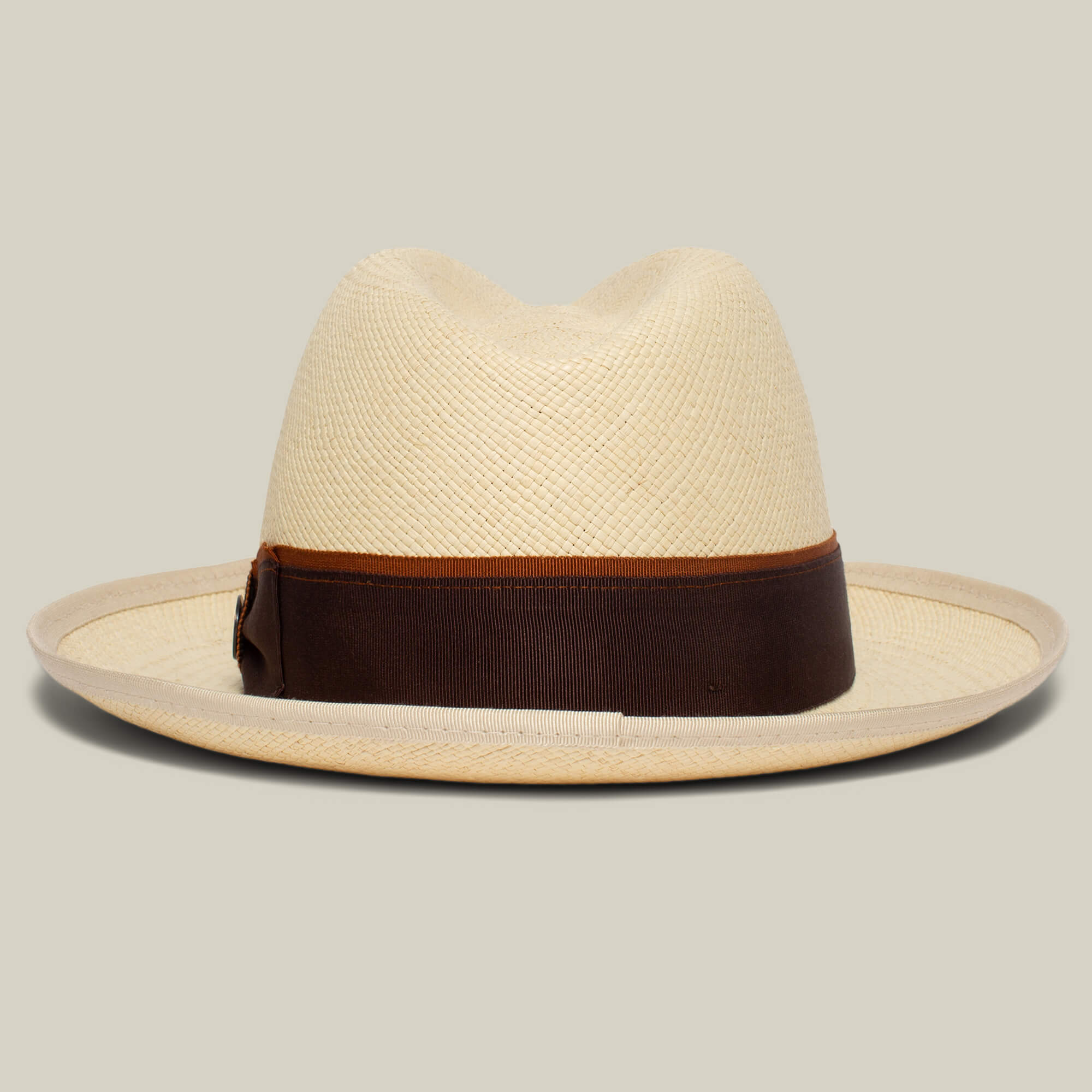 The Hartman by Goorin Bros. is a light straw fedora with a wide brim and a dark brown grosgrain band for classic style.