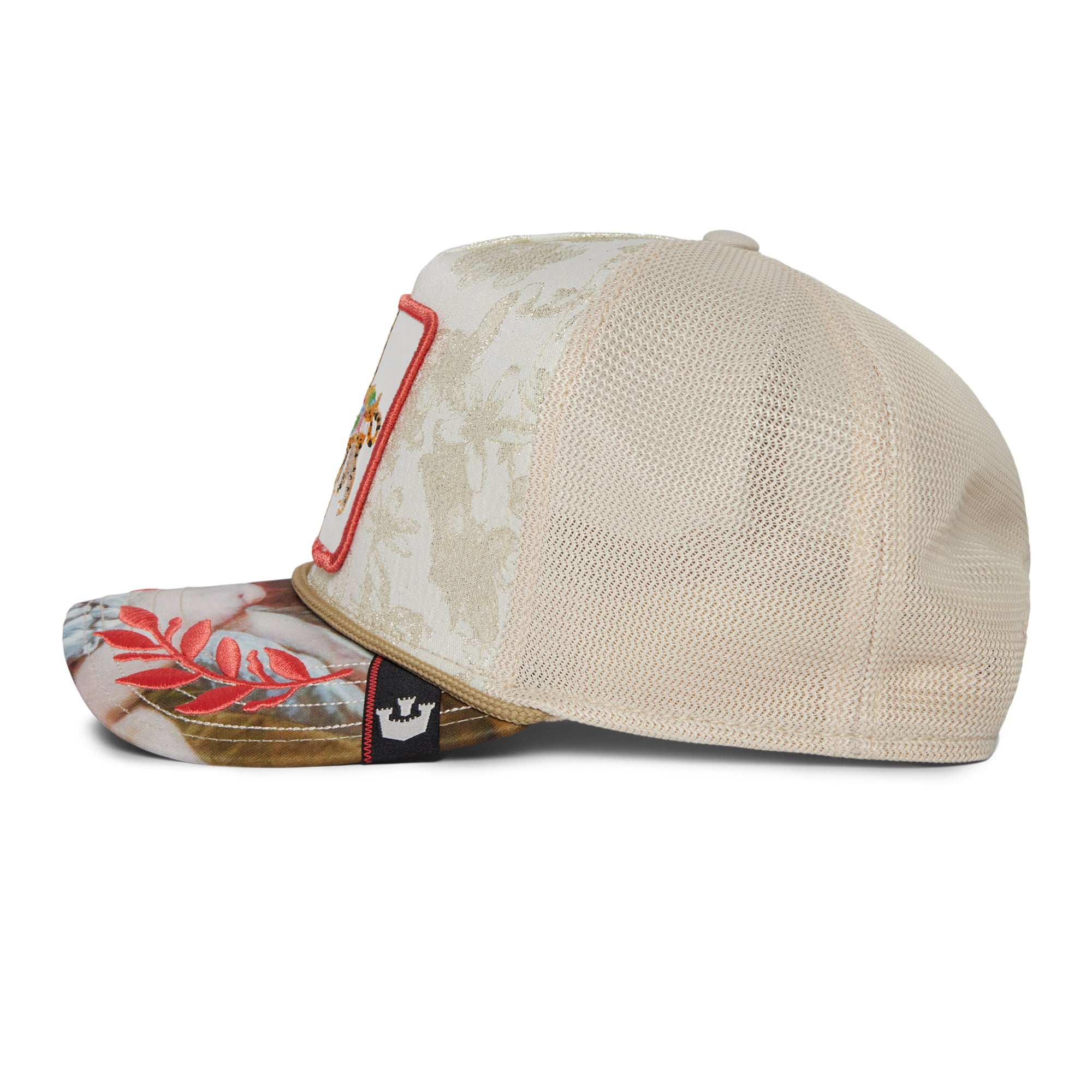 The Farm Quid Glorier beige mesh trucker hat with a floral-patterned brim, side view, features a fabric patch on the front and a small black logo tag on the brim. All sales final.