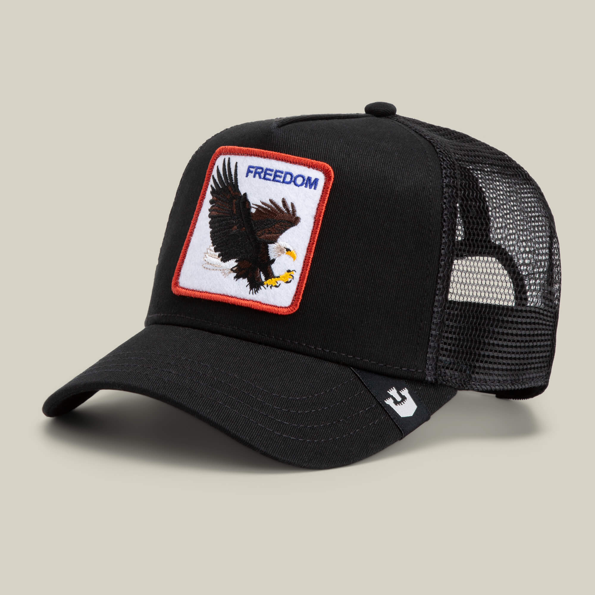 The Farm's The Freedom Eagle is a black mesh trucker hat featuring an embroidered eagle and FREEDOM patch—perfect for making a bold statement with unique style.
