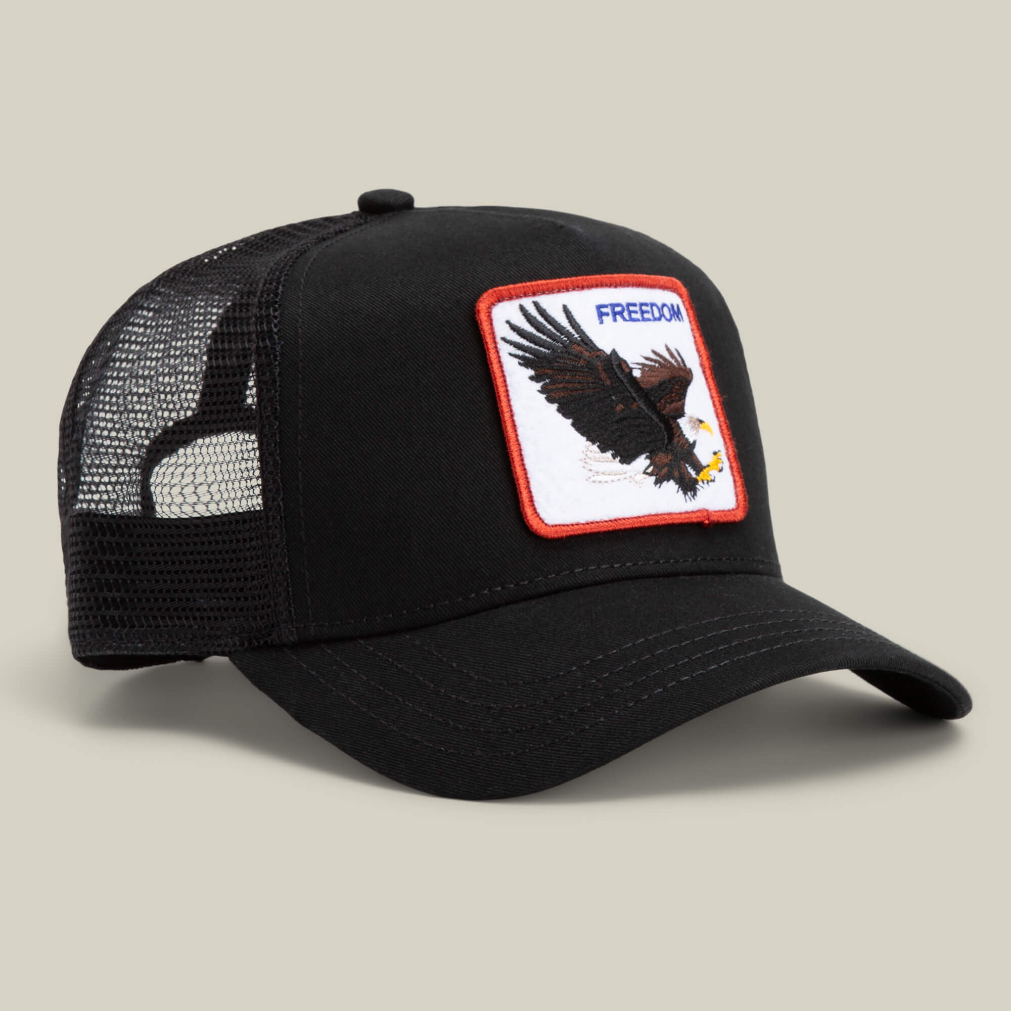 The Farm’s The Freedom Eagle hat is a black mesh trucker featuring a front patch with an eagle in flight and "FREEDOM" above—make a bold statement while keeping your distance.