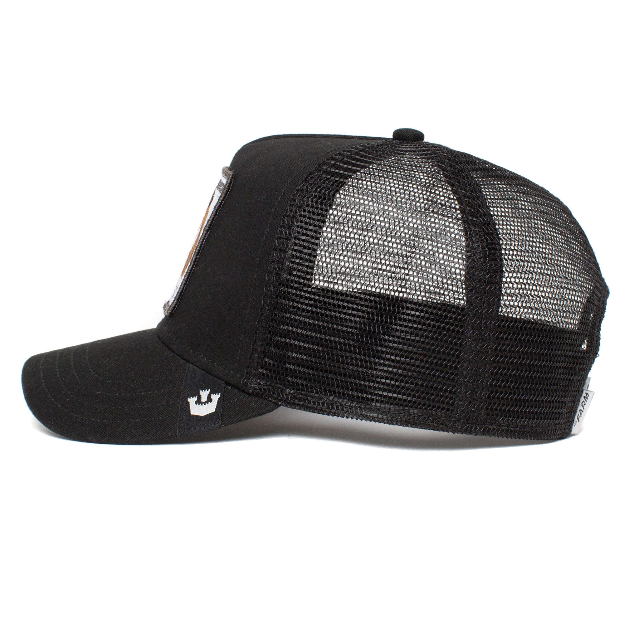The Butch by The Farm: black mesh trucker hat shown from the side, with a curved brim and adjustable snapback closure. All sales final.