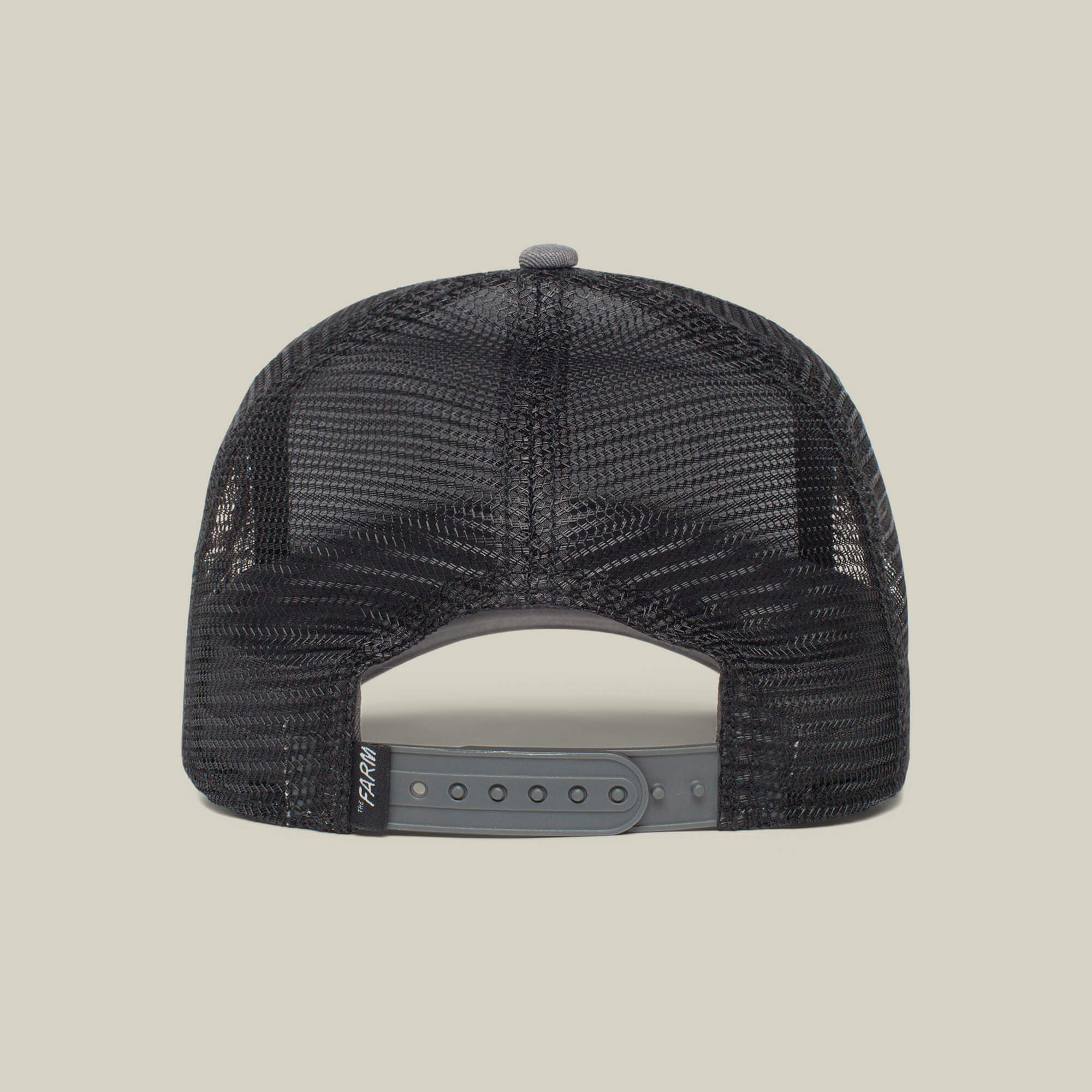 The Boss by The Farm is a black mesh trucker hat with a gray snapback closure and a small black fabric tag on the left side—ideal for your next movie night. Add to cart for effortless style.