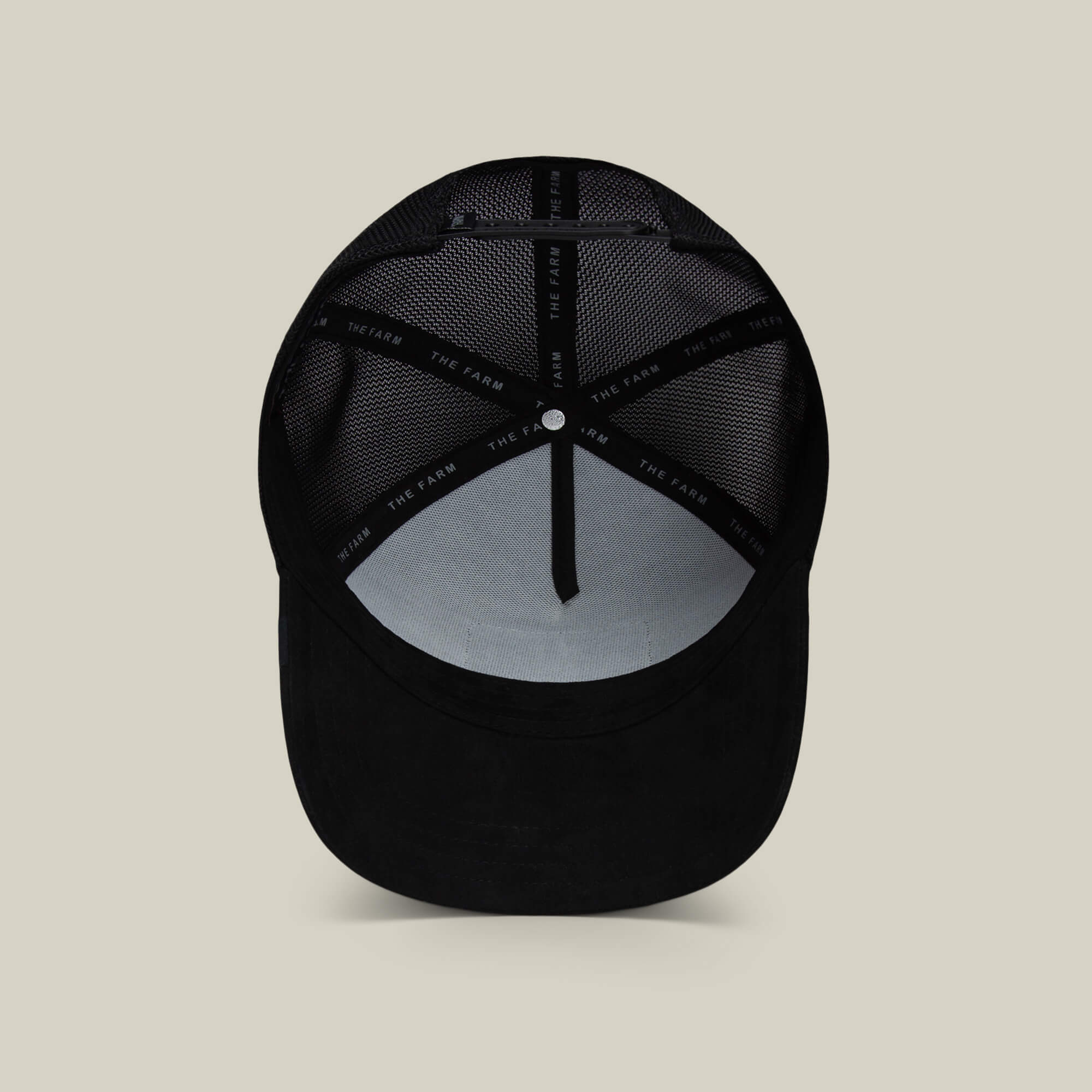 A view of The Suede Spider by Goorin Bros. from the inside, highlighting mesh panels and a fabric strip labeled THE FARM—an ideal funny dad gift.