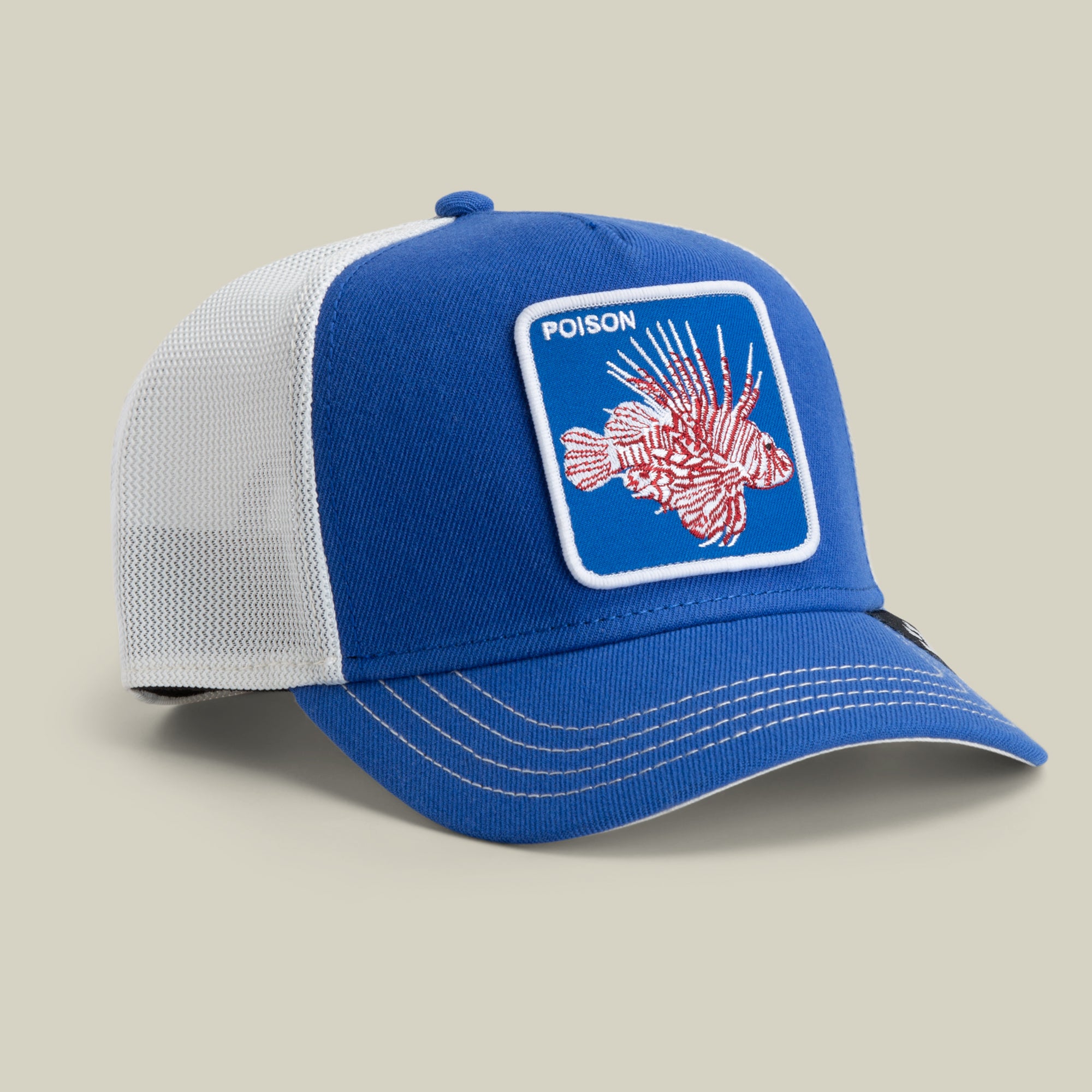 The Farm's Lionfish Heat is a blue and white mesh trucker hat with a front patch showing a lionfish illustration and "POISON." All sales are final.