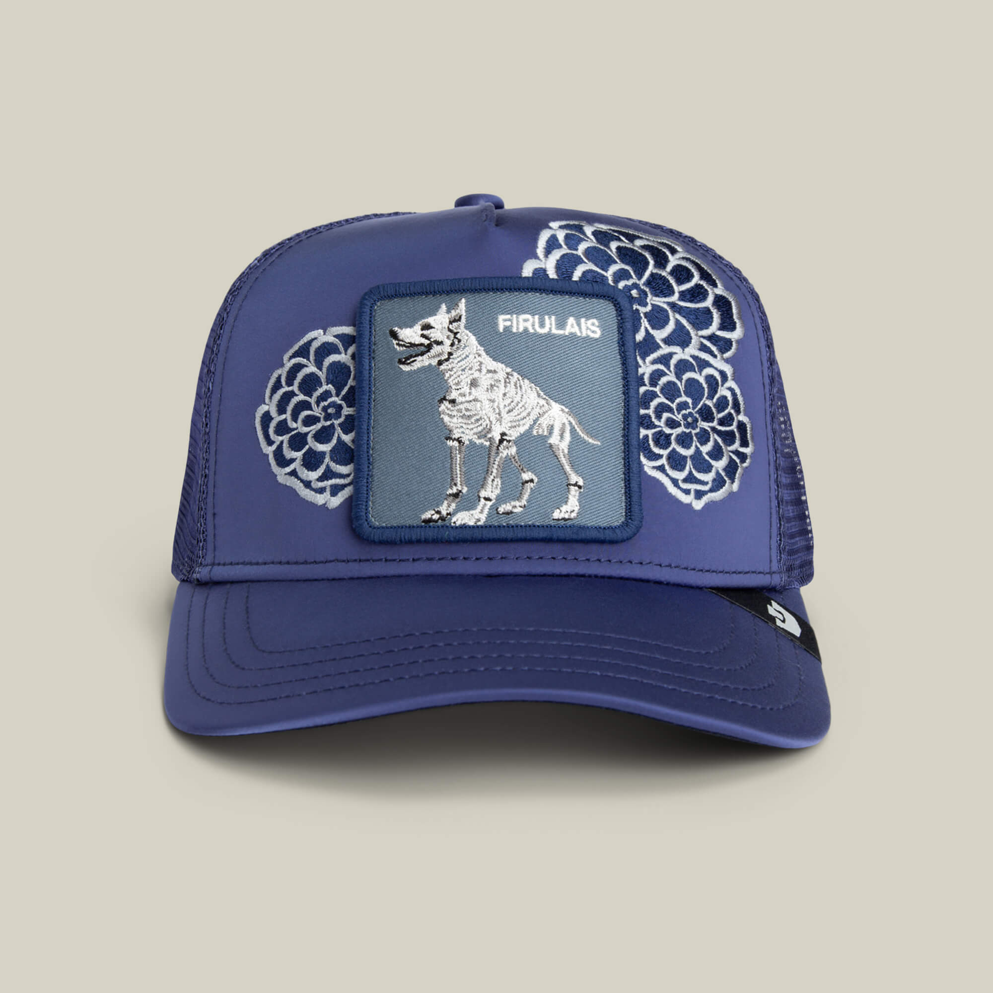 The Goorin Bros. Dia De Firulais hat in celestial blue features white floral designs and a patch with a skeletal dog and "FIRULAIS" on the front.