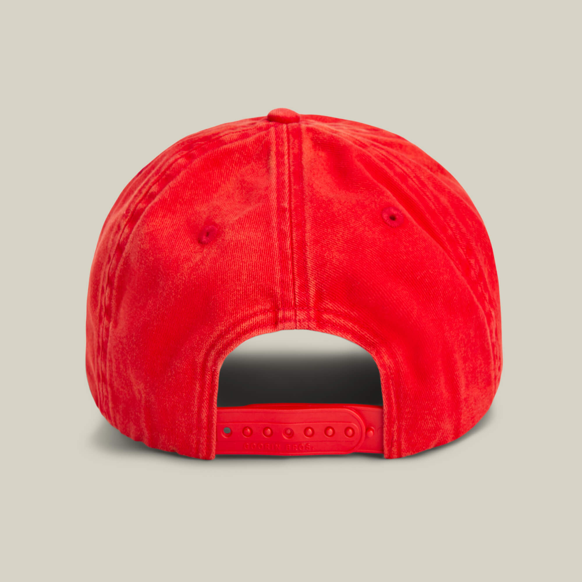 The Goorin Bros. Papa Cap Italiano is a classic red cap, seen from the back, and features an adjustable snap closure.