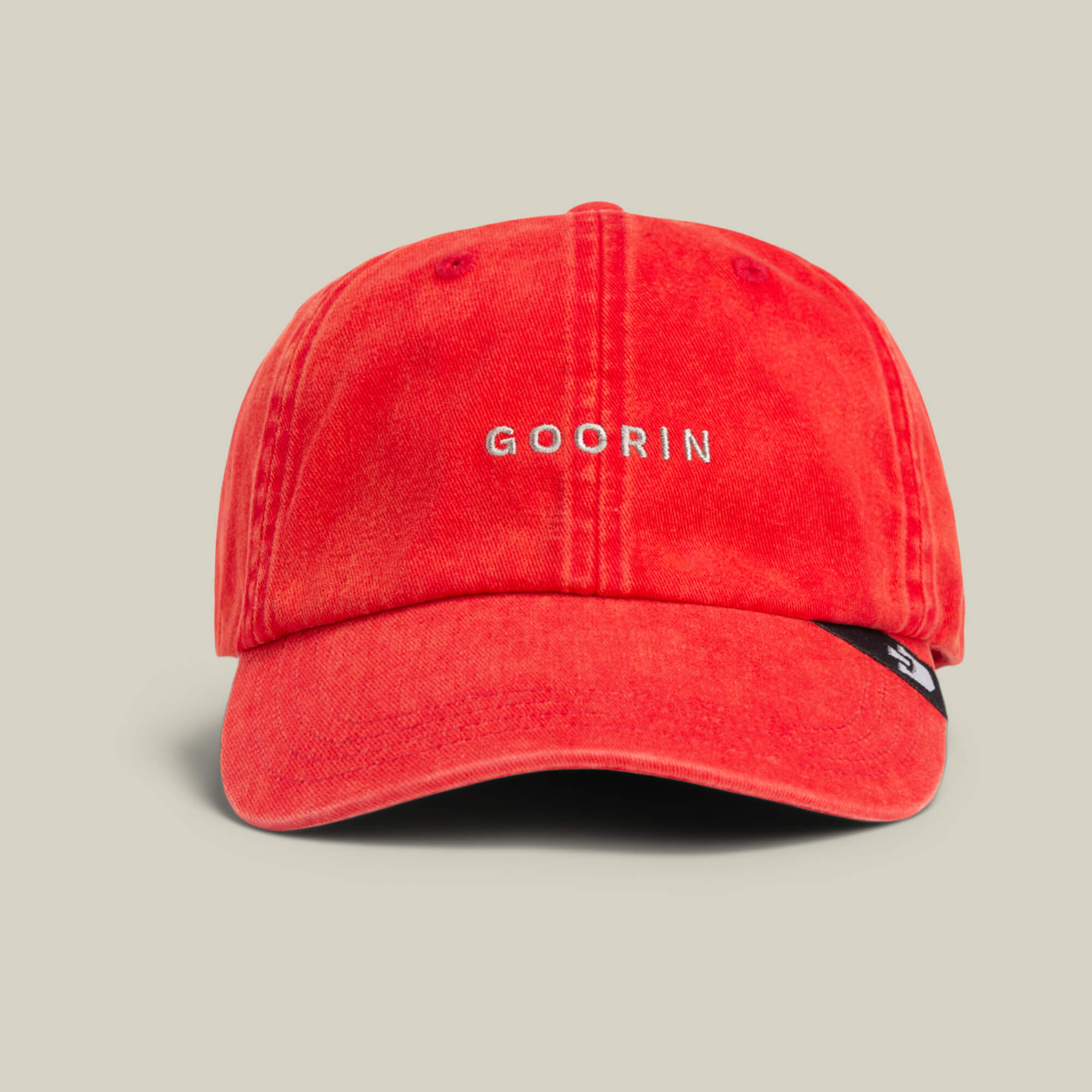 A classic red Papa Cap Italiano by Goorin Bros. features white embroidered GOORIN on the front and is shown against a plain beige background.