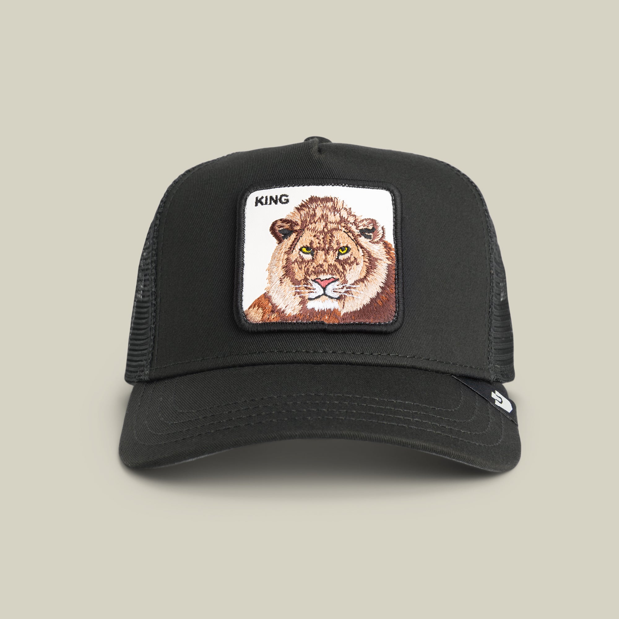 The Goorin Bros. King Trucker hat is a bold black mesh-back cap with a lion patch and the word KING on the front—perfect for power dressing.