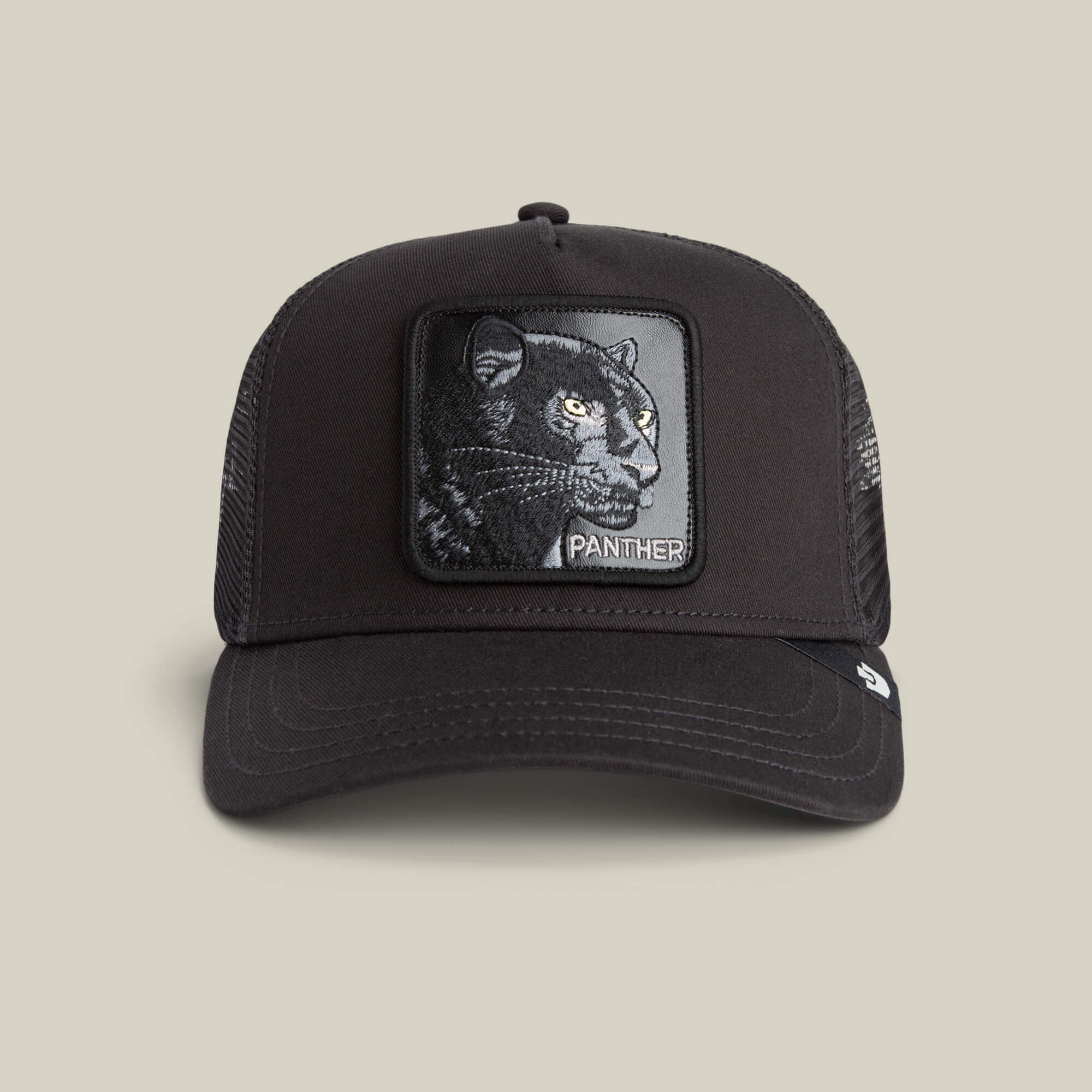 The Panther by Goorin Bros. is a stylish black mesh trucker hat featuring a front patch with an embroidered black panther and the word PANTHER.