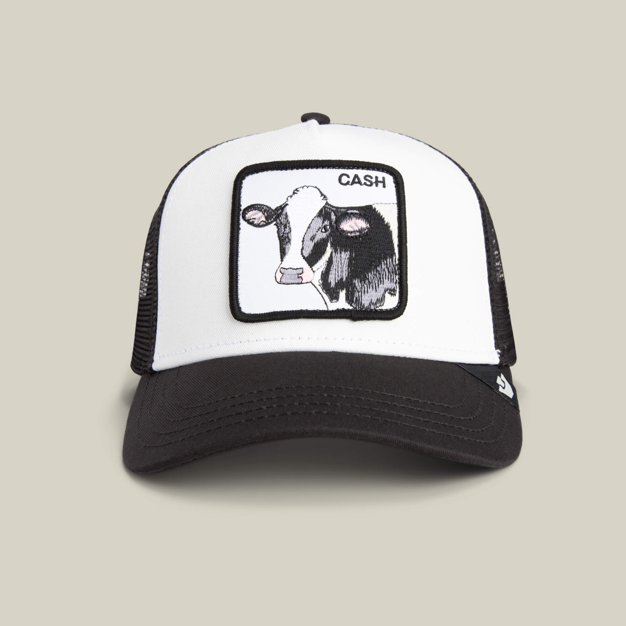 The Goorin Bros. Cash Cow Trucker is a black and white hat featuring a bold cow patch with "Cash Cow" on the front.