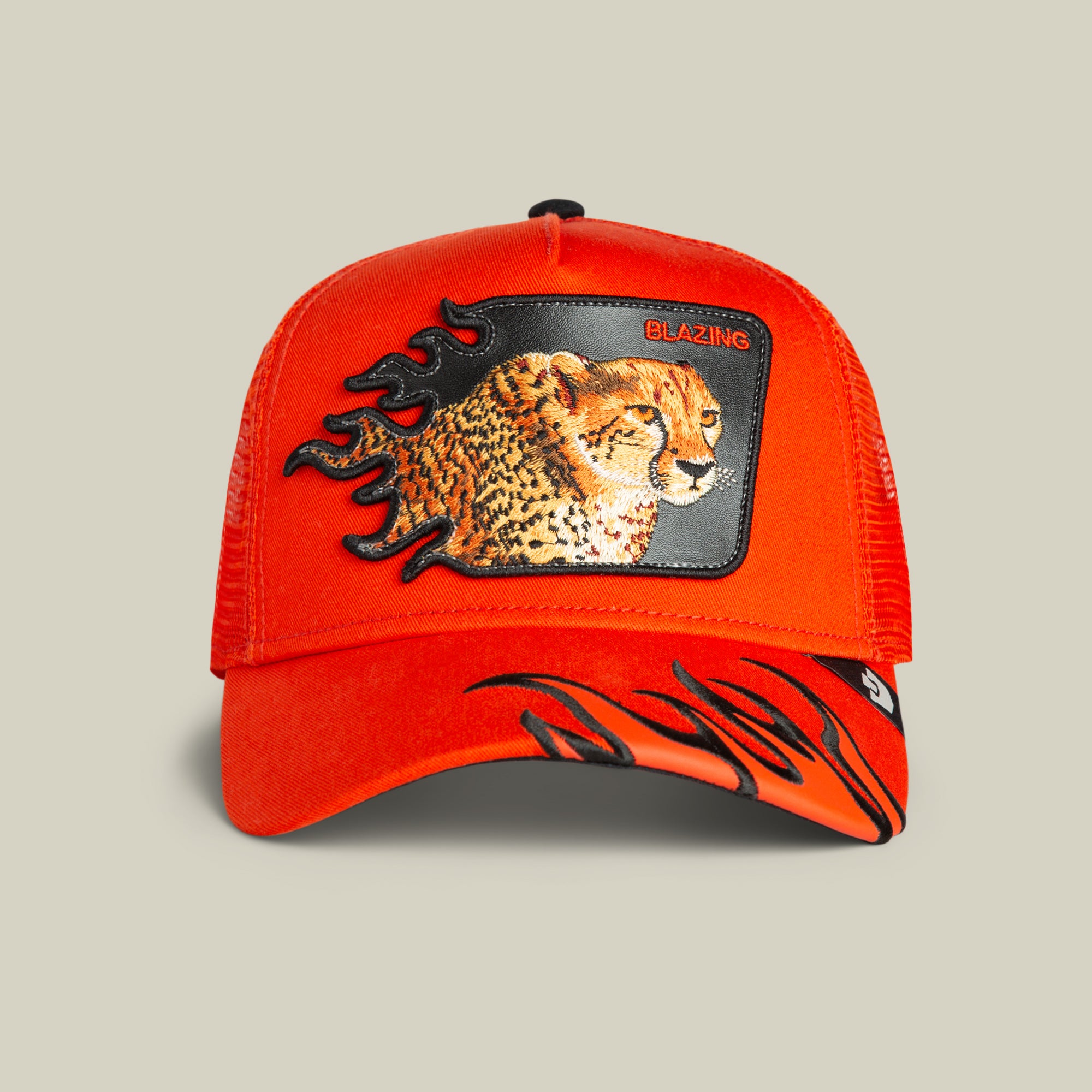 The Goorin Bros. Blazing Flames trucker cap in BLAZE features a bold cheetah patch with "BLAZING" and striking black flame accents on the cap and bill for extra flair.