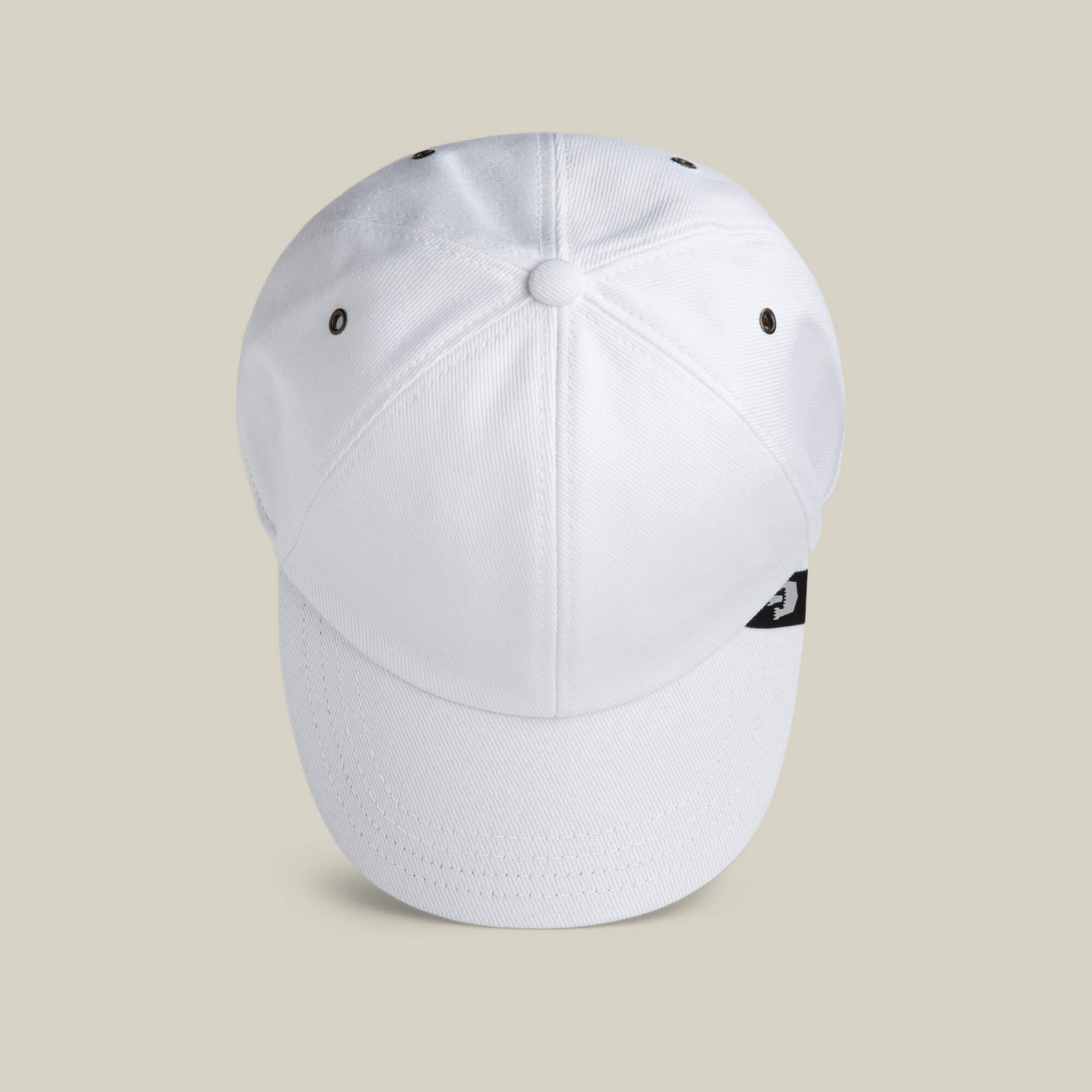 A Clean Denim Papa dad cap by Goorin Bros. is shown from above, highlighting its white top panel stitching and ventilation eyelets against a neutral background.