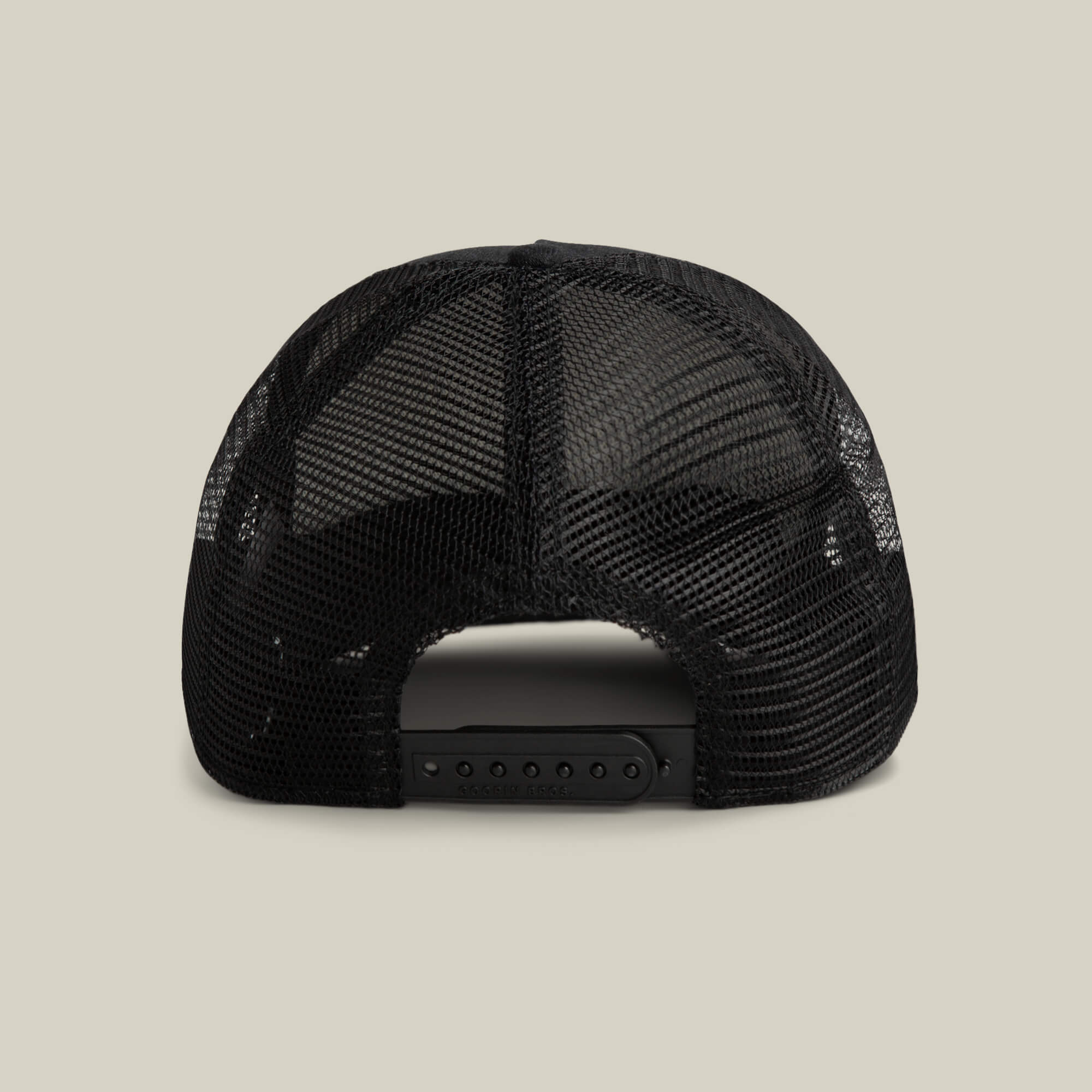 Back view of the Goorin Bros. Clean Denim Trucker hat in black mesh with an adjustable snapback closure, shown against a plain light background.