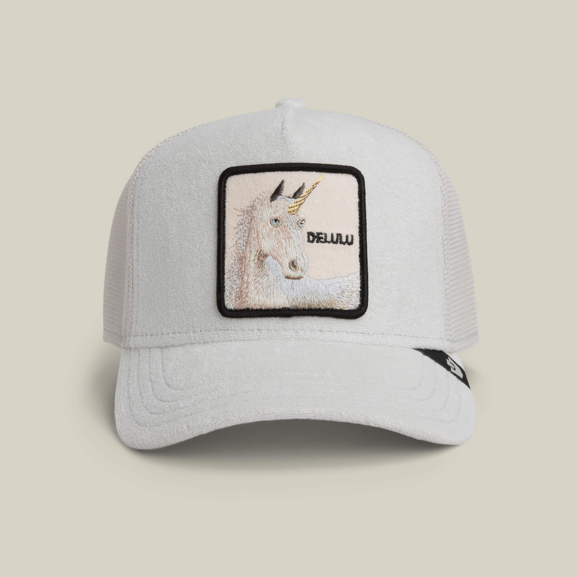The Goorin Bros. Terry Cloth Unicorn hat in DIGITAL color features a soft unicorn patch and "DELULU" on the front, bringing playful charm to your style.
