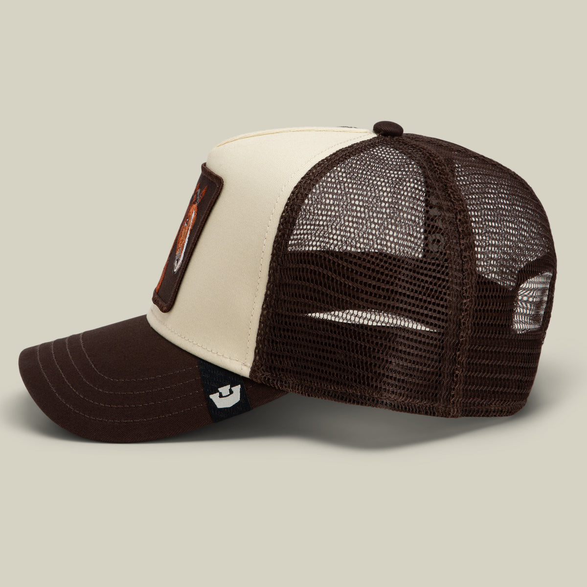 Gaucho Trucker hat in a brown and cream earthy colorway, featuring a mesh back and a horse patch on the front panel.