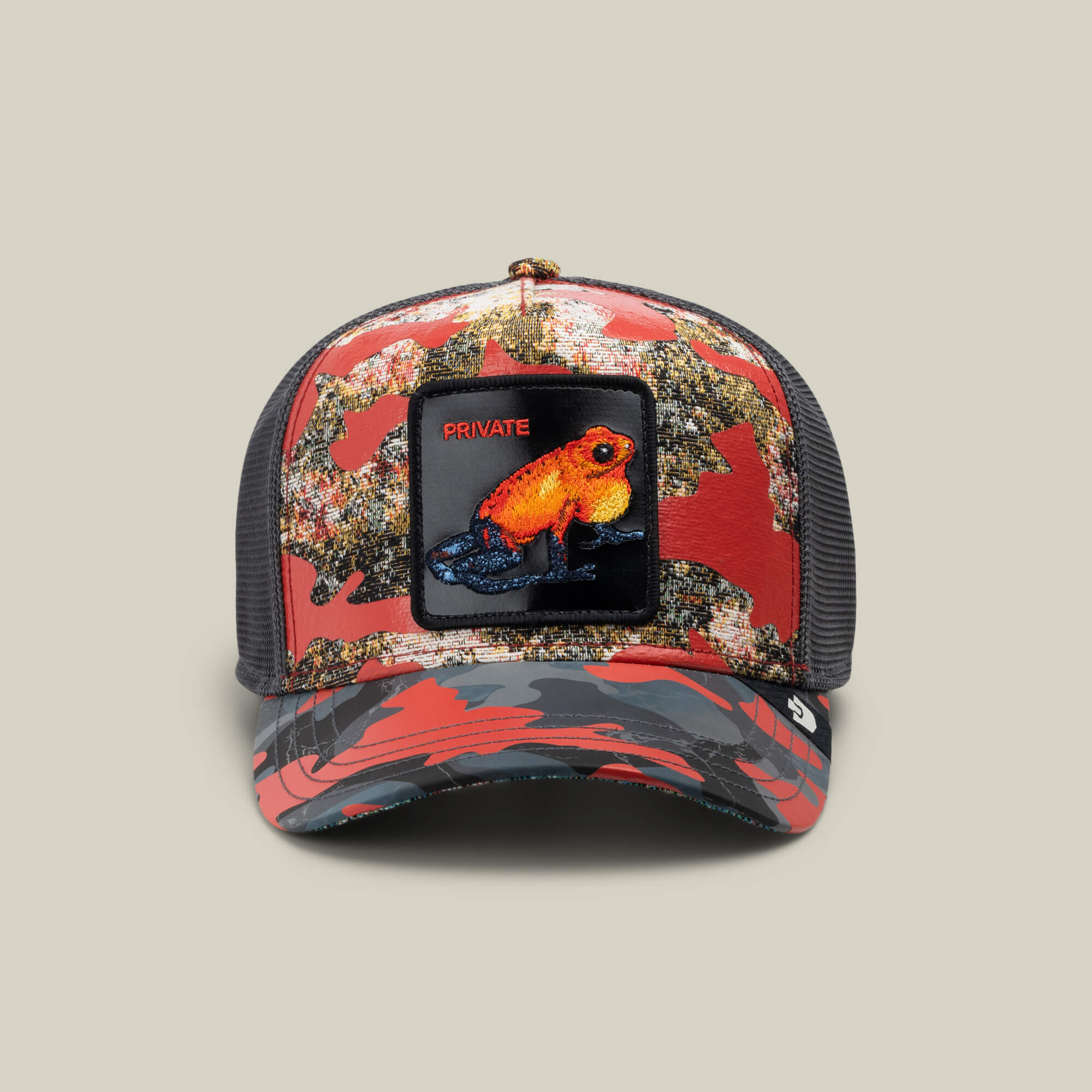 The Goorin Bros. "Secret Service" trucker cap in CLAY features a bold patch of an orange frog with "PRIVATE" above it—perfect for standing out with Private Red Rank style.