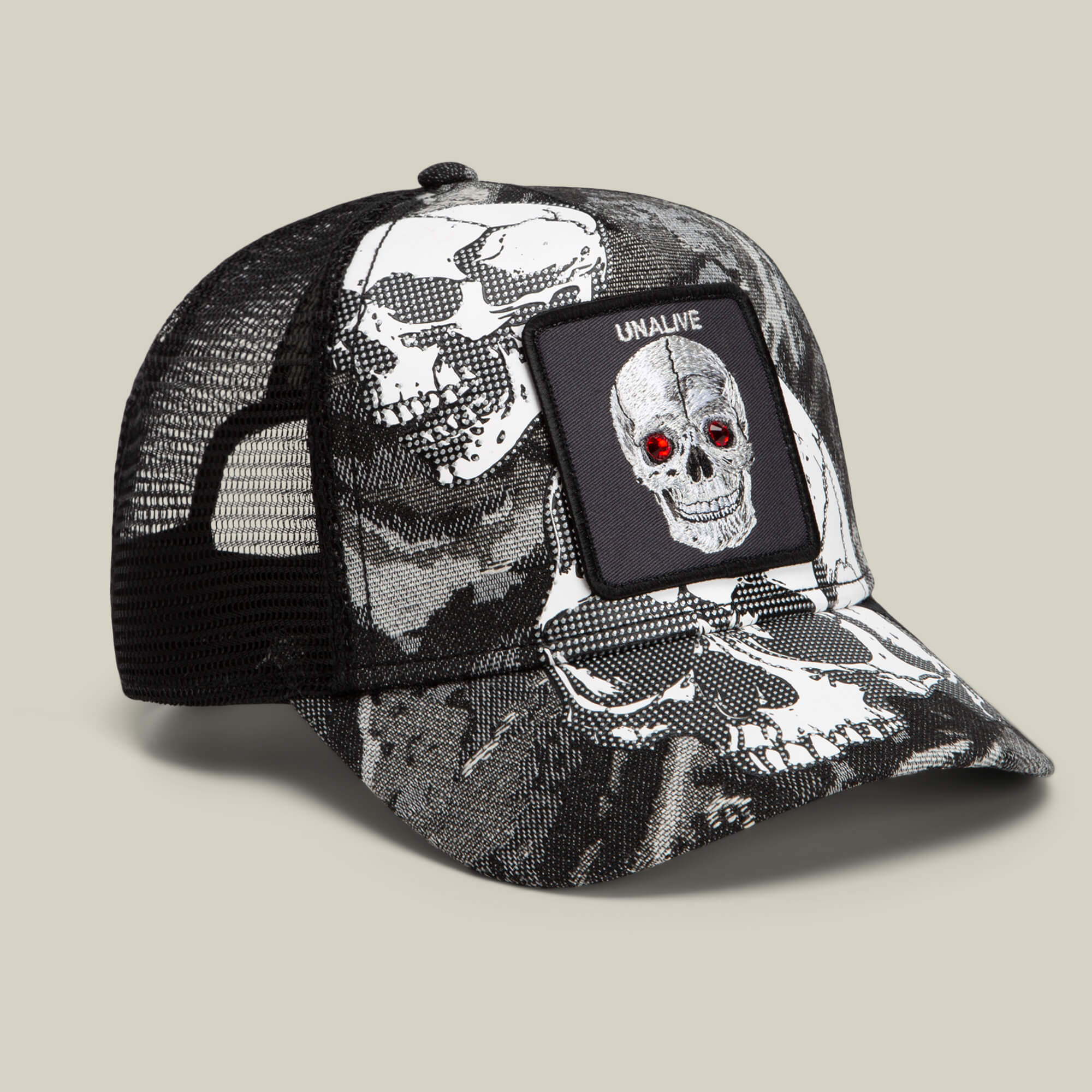 The Bone Head Unalive by Goorin Bros. is a bold black-and-white trucker hat featuring a breathable black mesh back, striking white skull graphics, and a front patch with a skull sporting red eyes and the word “UNALIVE.” Inspired by iconic street style, this edgy accessory is perfect for fans of Goorin Bros.’ distinctive look.