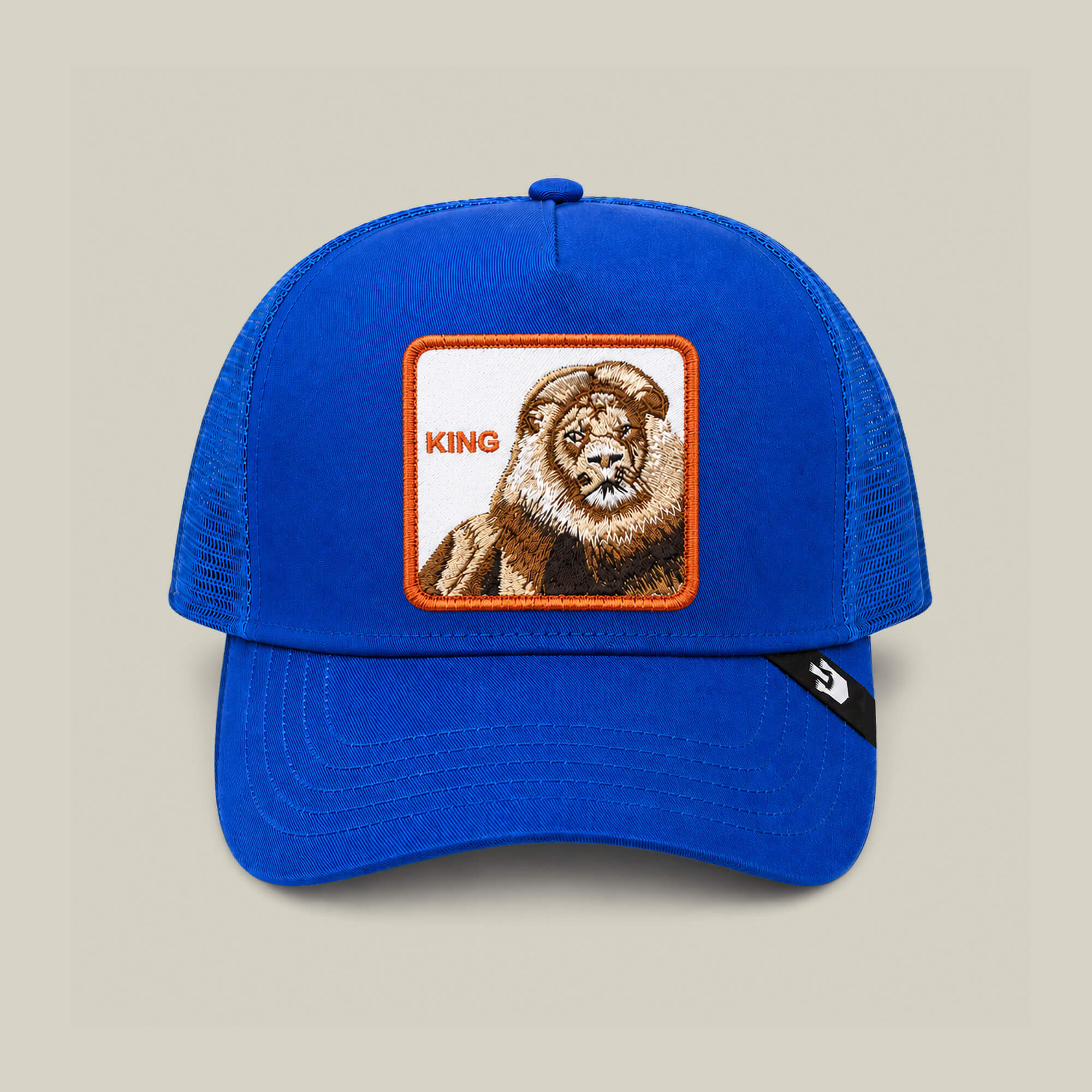 Pre-order the Goorin Bros. Empire State of Mind cap in royal blue, featuring a lion patch and KING embroidery on the front—perfect for showing your regal style.