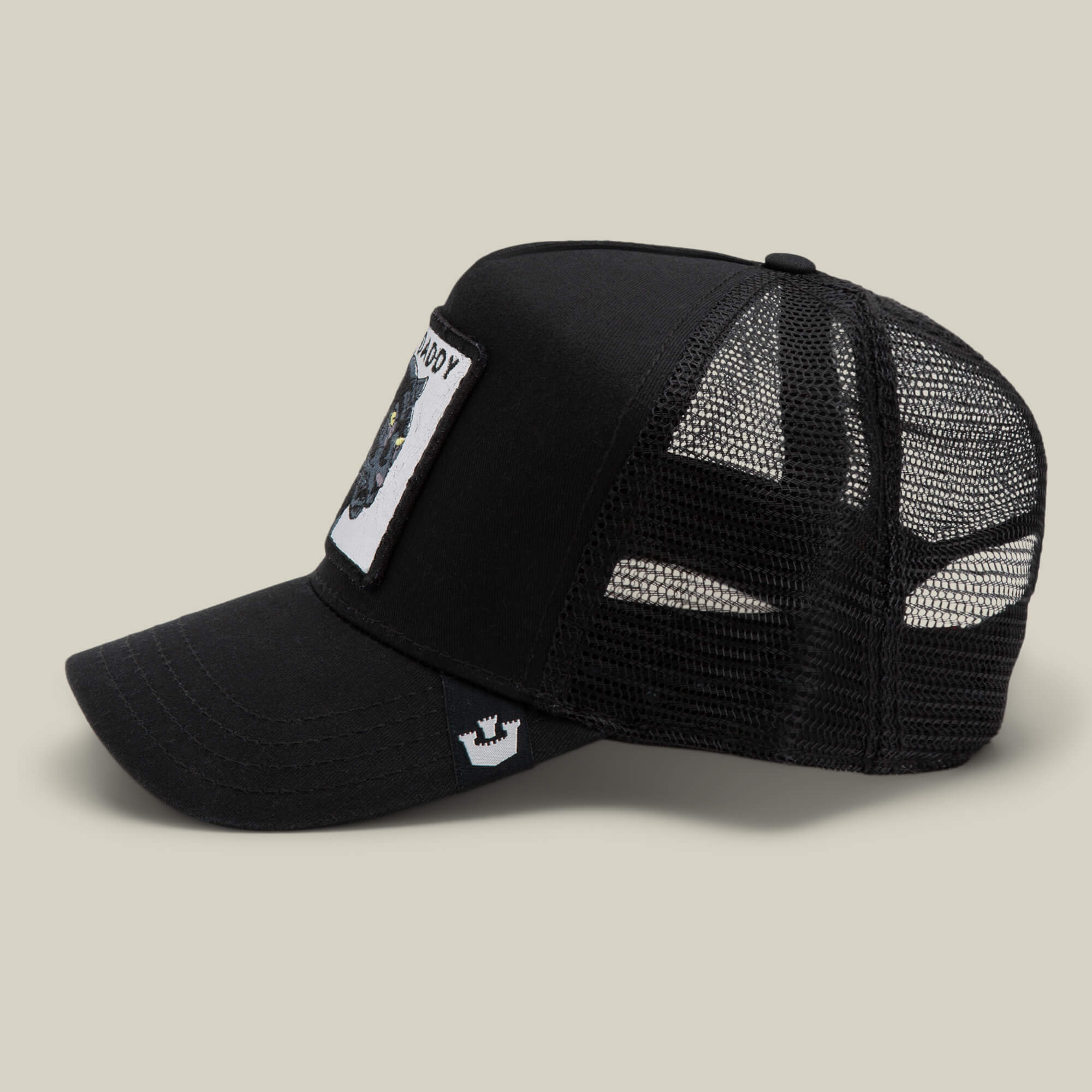 The Daddy Panther by Goorin Bros. is a black mesh trucker hat with a curved brim, white front patch, and small white crown logo on the visor, displayed against a plain background.