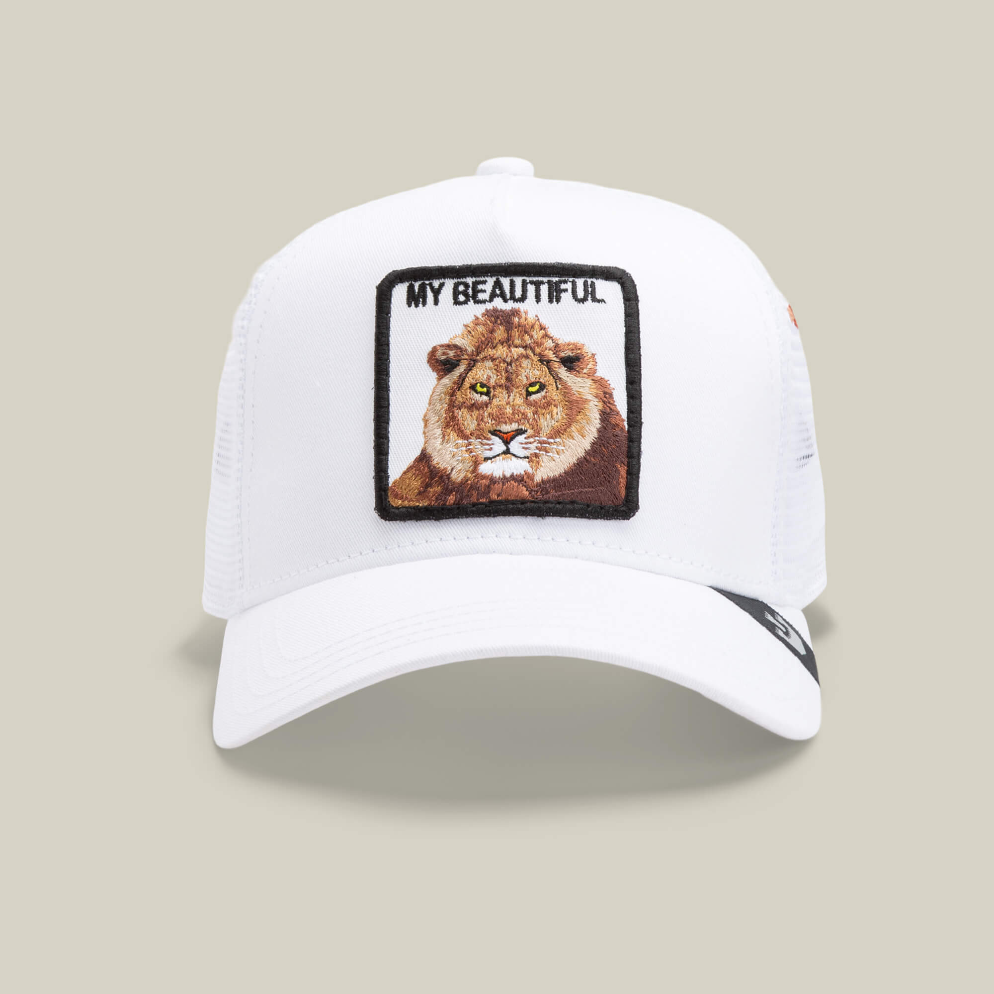 The Goorin Bros. Dave Scott My Beautiful Lion hat in white features a mesh trucker style with a front patch showing a lion’s face and "MY BEAUTIFUL" text—an iconic standout from their collection.