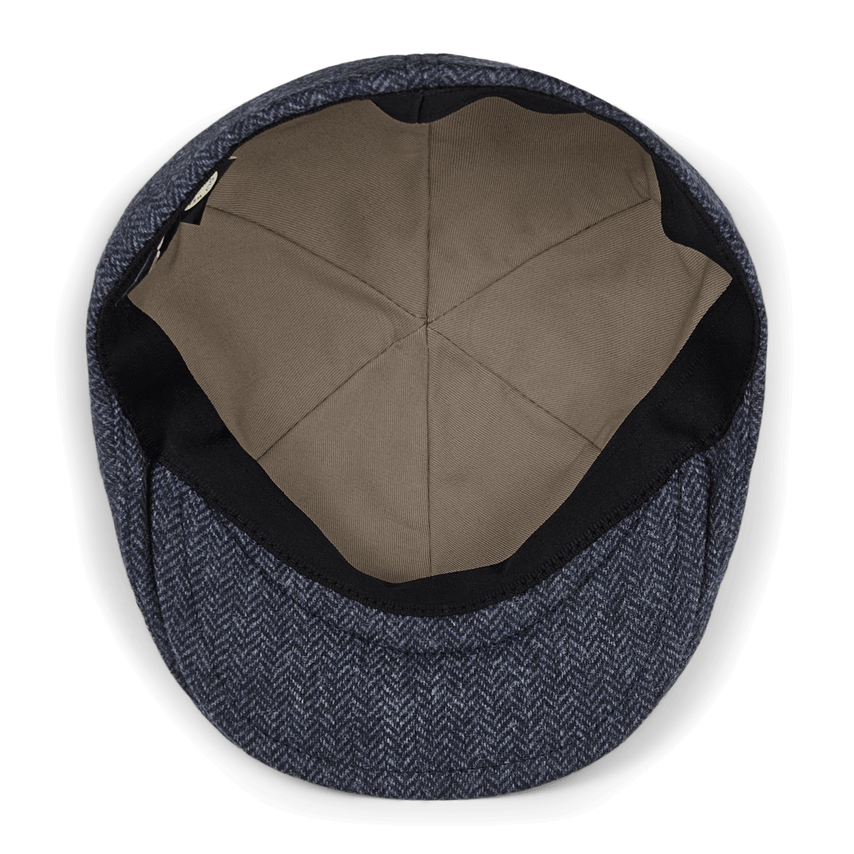 A top-down view of the Goorin Bros. “Harry Bones” flat cap, featuring a textured blue-gray outer fabric and a toast tan interior lining, hand-cut in the USA, shown empty on a white background.