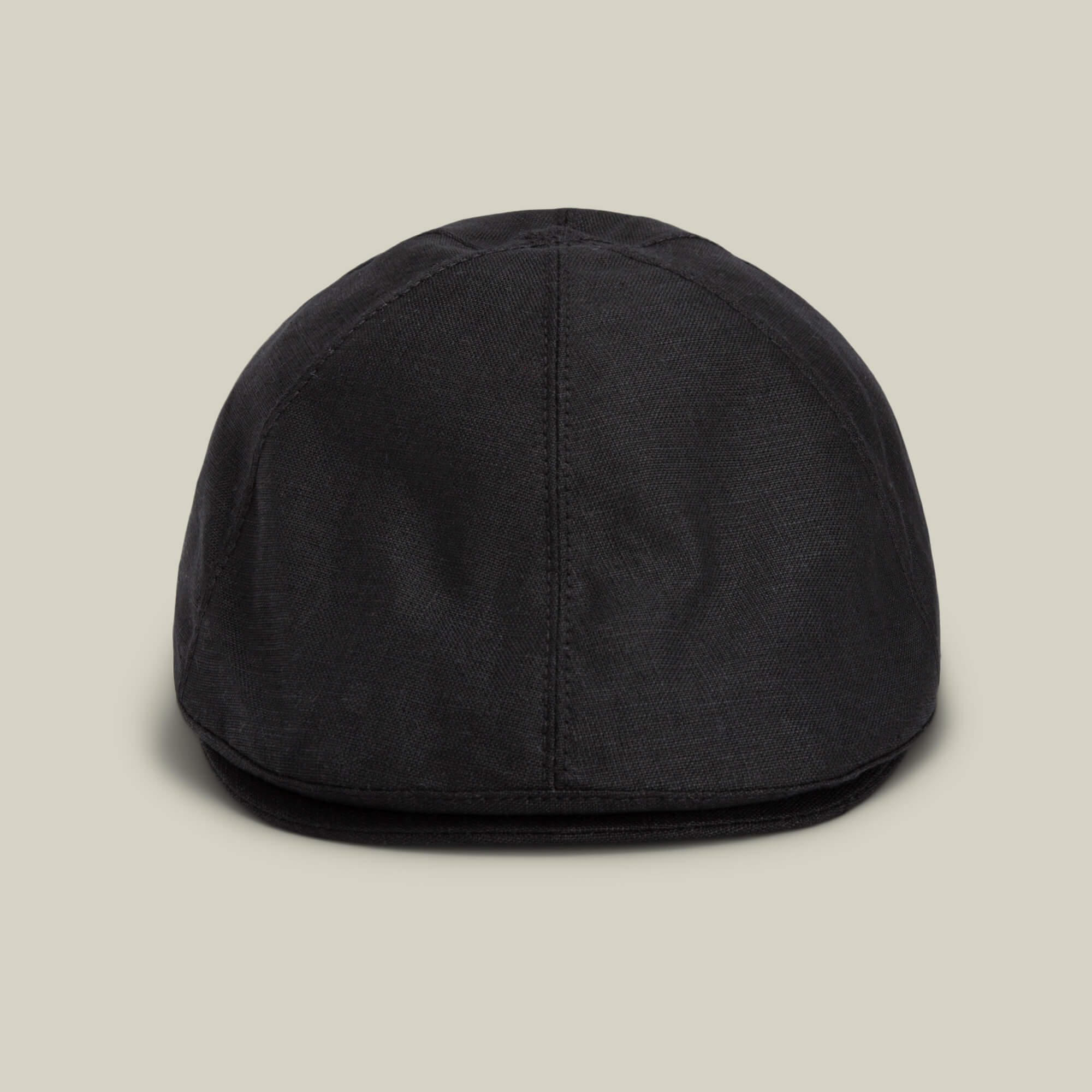 The Benjamin Paul hat by Goorin Bros. is shown from the front in black linen against a beige background, offering a stylish choice for everyday wear.