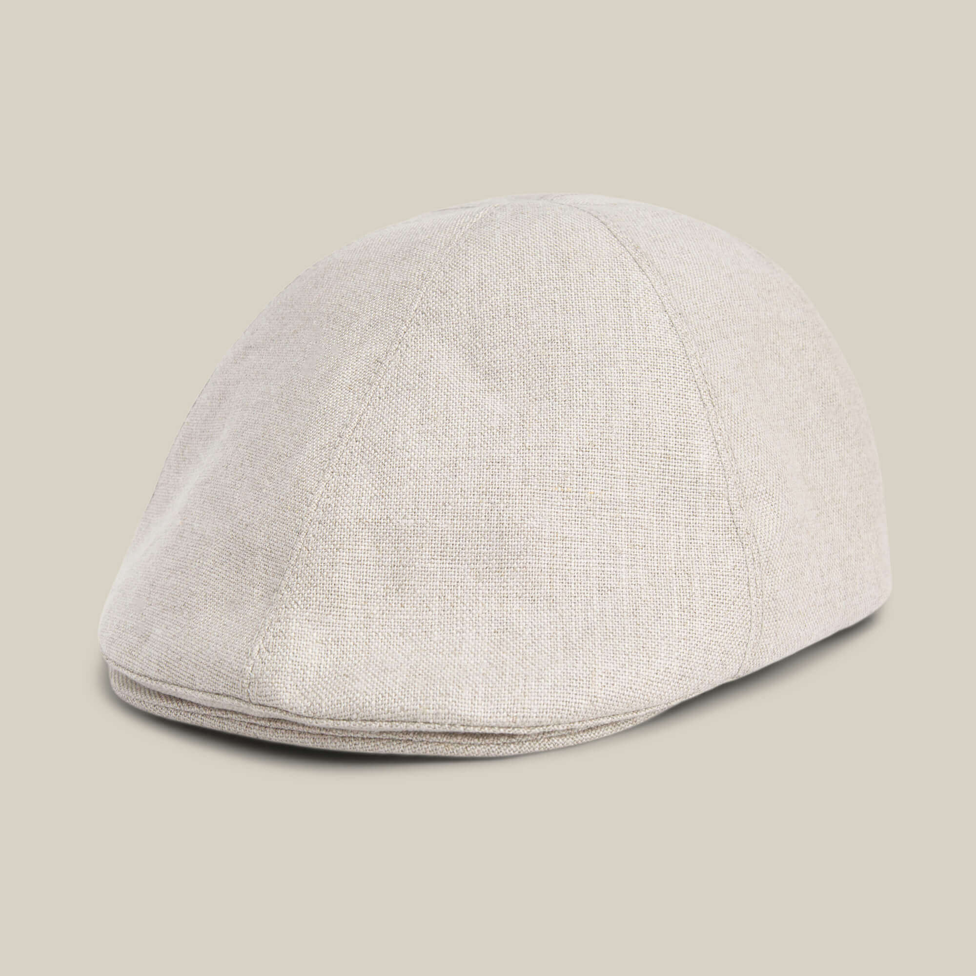 The Benjamin Paul hat by Goorin Bros., in light beige textured linen, is shown on a neutral background from a front side angle.