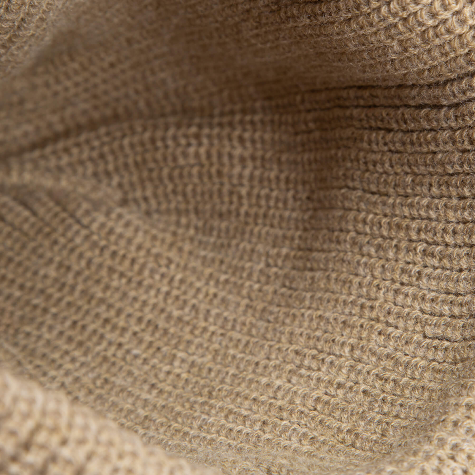 Close-up of the earth-tone knit, highlighting the detailed yarn texture of The Bandit Beanie by Goorin Bros.—ideal for a cozy winter hat.