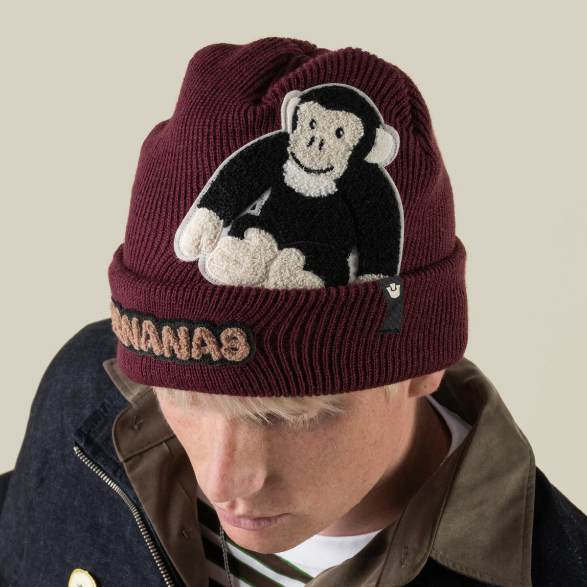 Maroon knit Double Stuffed - Bananas Beanie - big featuring a monkey patch and the word BANANAS embroidered on the brim.