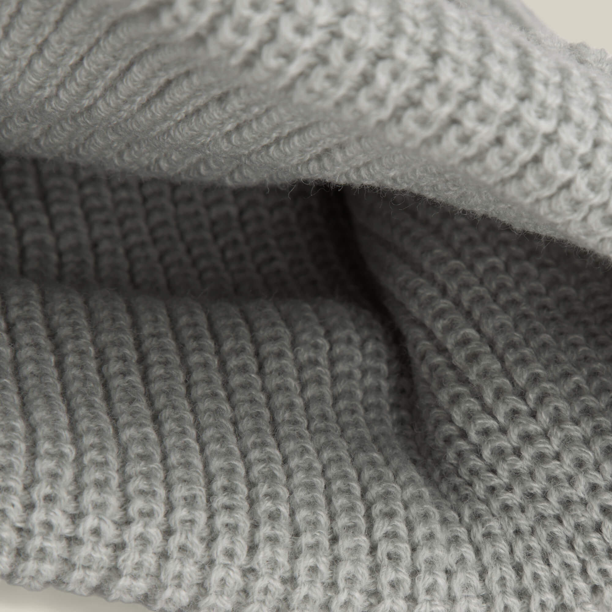 Close-up of the Air to Fakie by Goorin Bros.—light grey poly knit fabric with textured ribbed stitching, ideal for an all-season watchman beanie.