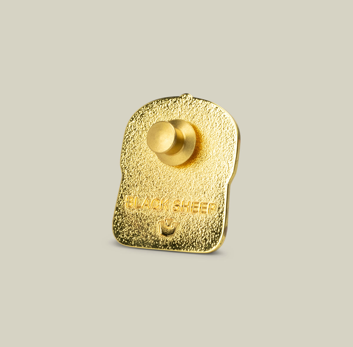 The Black Sheep Trucker Pin by Goorin Bros. has a textured surface, engraved details, and a sheep icon—an ideal accessory for any trucker hat.