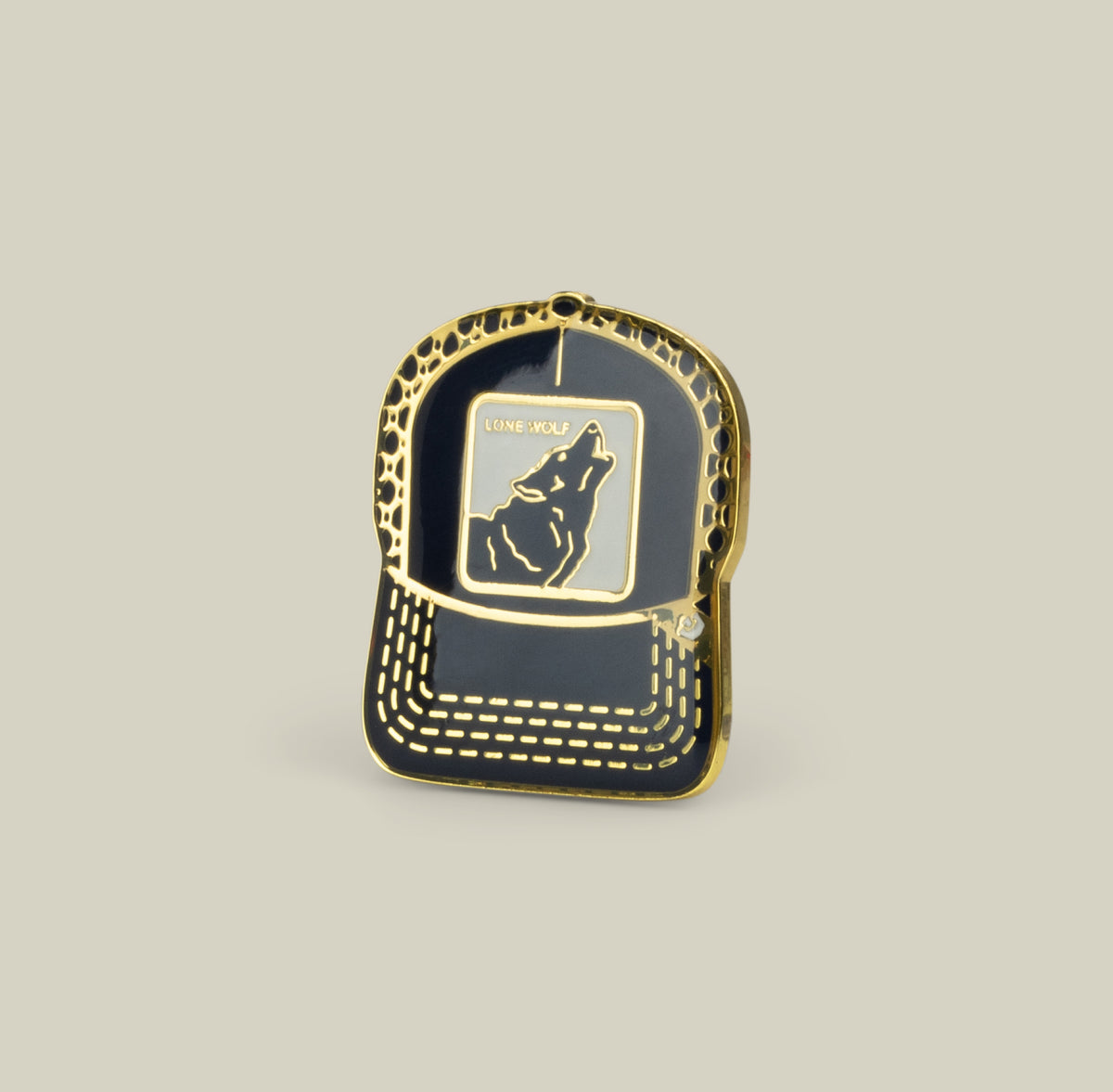 The Goorin Bros. Lone Wolf Trucker Pin in Pennant features a trucker hat shape with a howling wolf and “Lone Wolf” above it.