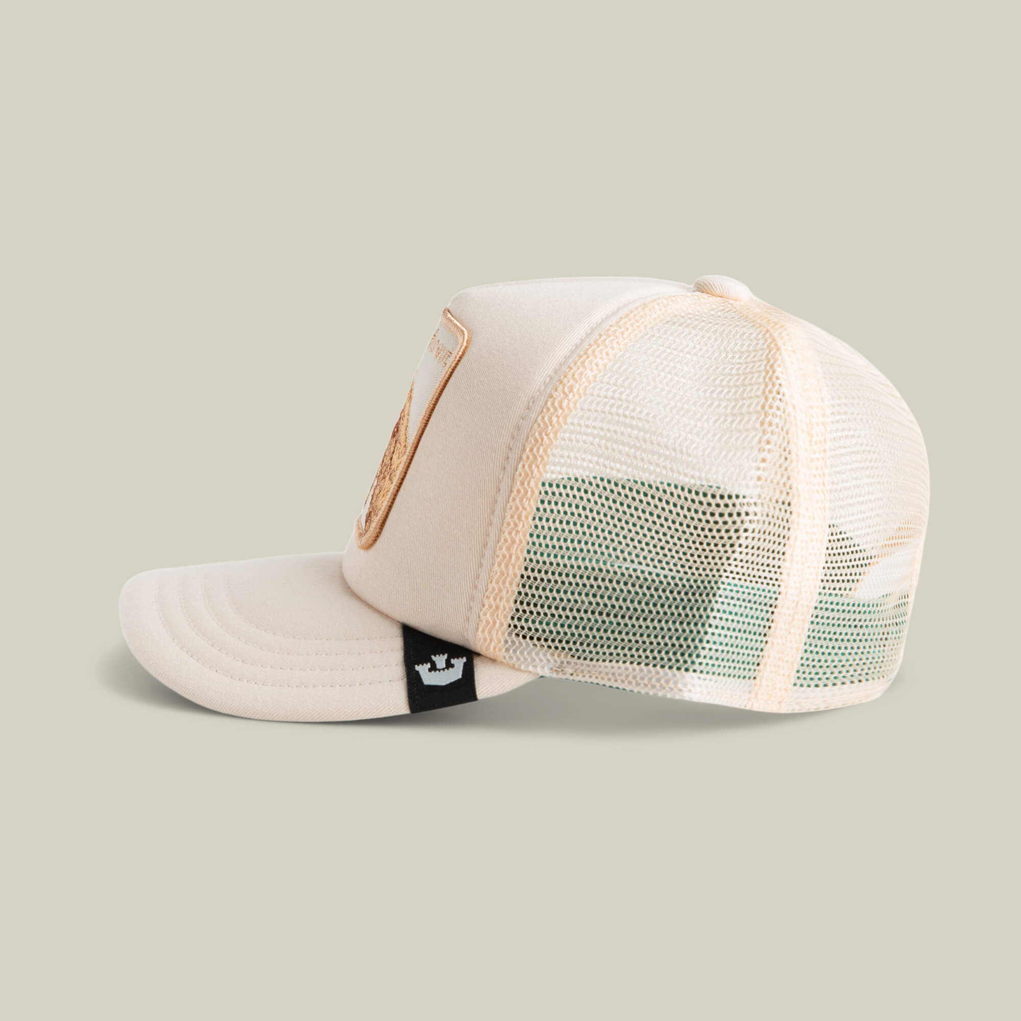 The Lil Far Out by Goorin Bros. is a beige mesh-back kids cap with a black and white tag on the left side, shown on a neutral background.
