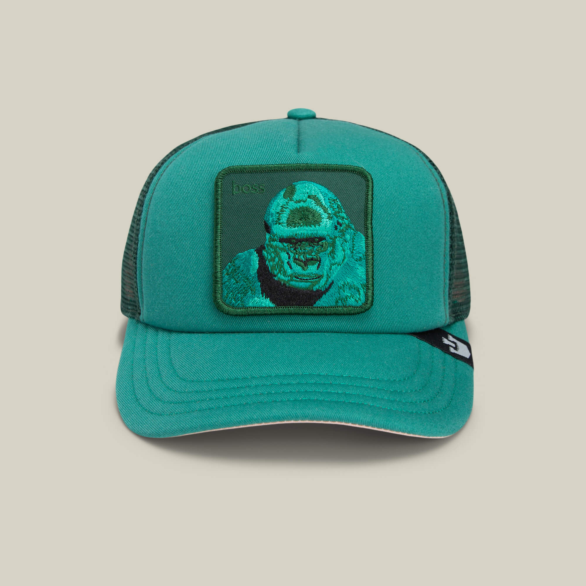 The Goorin Bros. Lil Boss is a green mesh snapback trucker cap with a square patch showing an embroidered gorilla face, making it a fun gorilla-themed hat for kids.