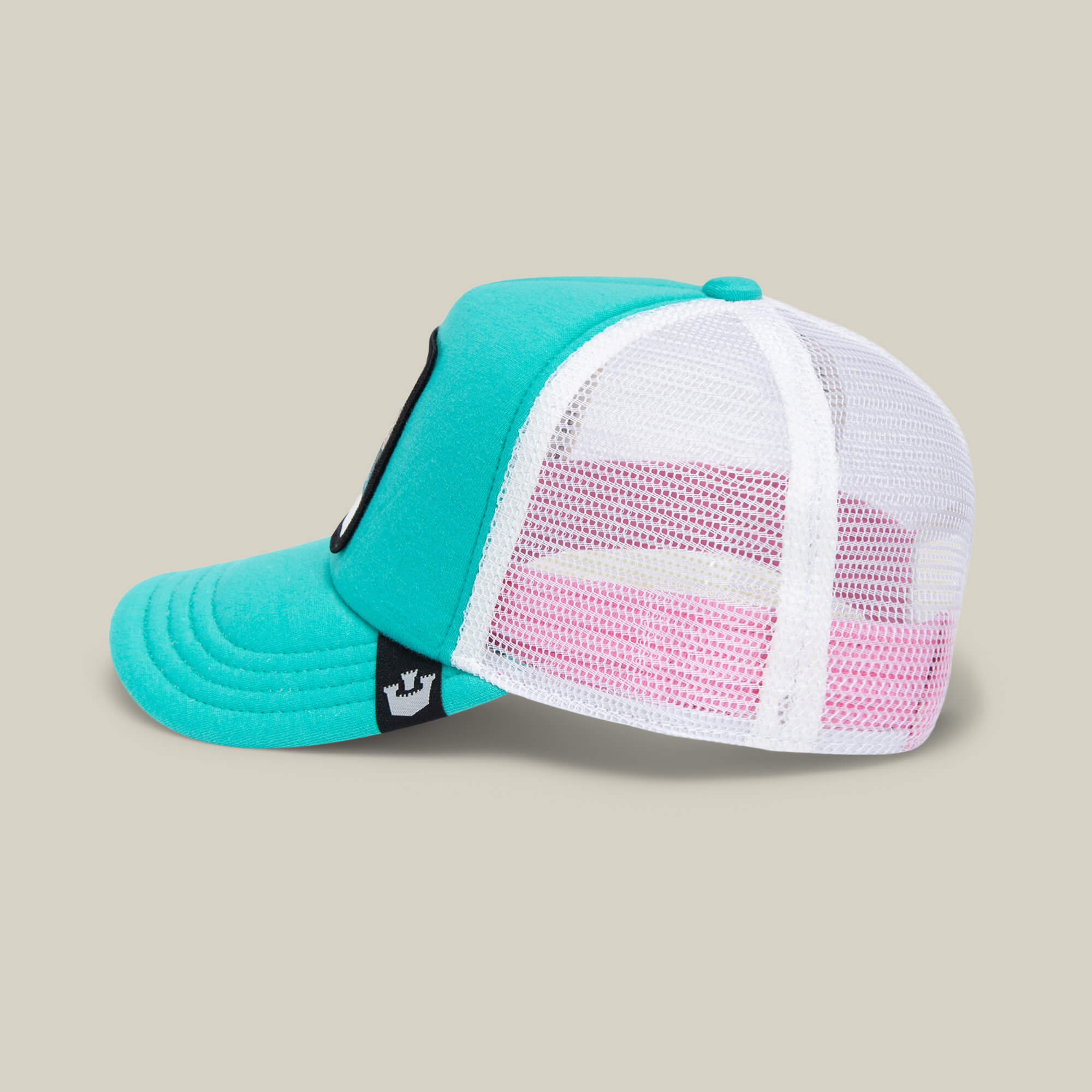 A “Do Do Doodoo Doodoo” trucker hat by Goorin Bros. in teal and pink, featuring a white mesh back panel and a small black logo tag, reminiscent of an aqua kids cap, displayed on a plain beige background.