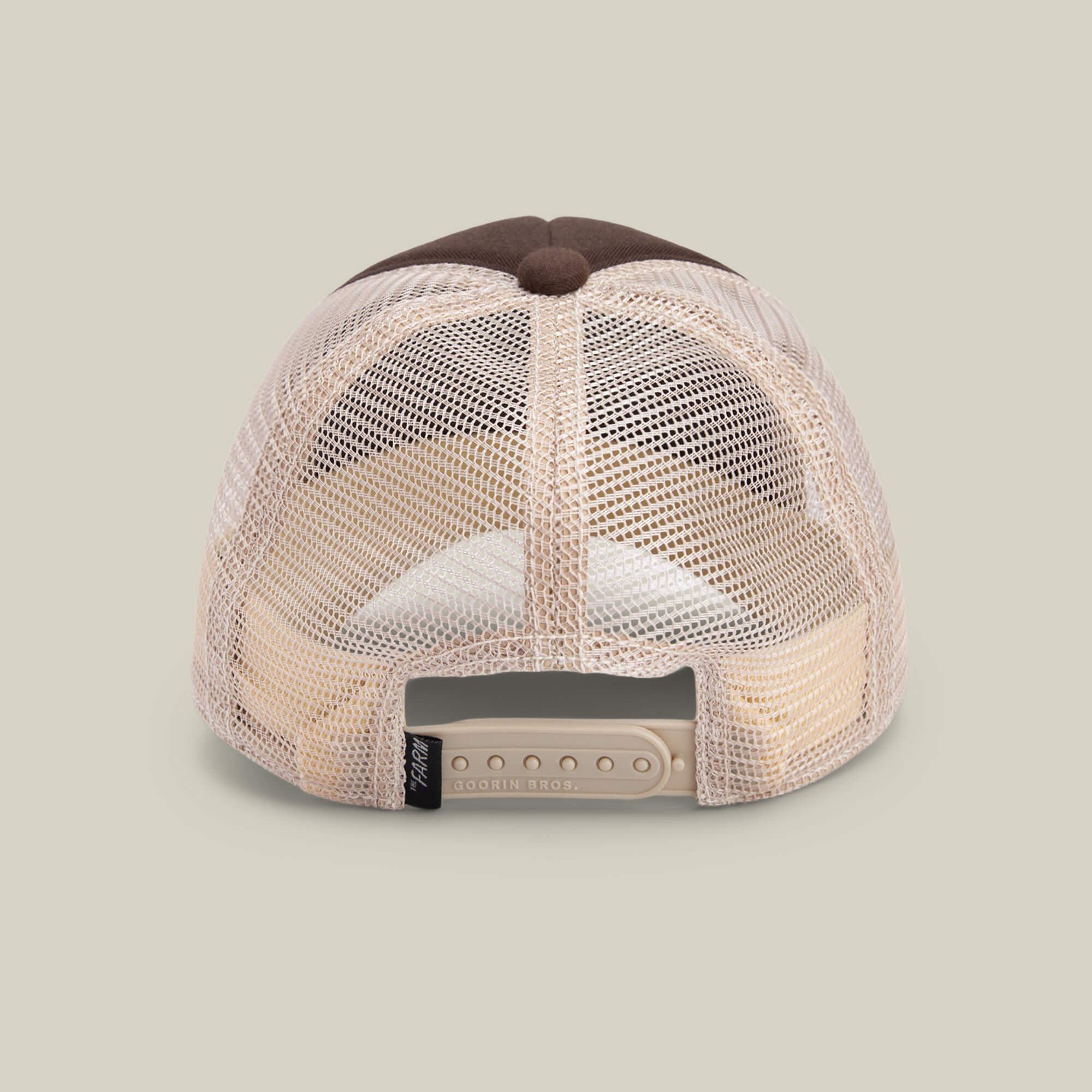 A back view of The Chaser kids cap by Goorin Bros., featuring a beige breathable mesh back, adjustable snapback closure, and a brown top button, displayed on a neutral background.