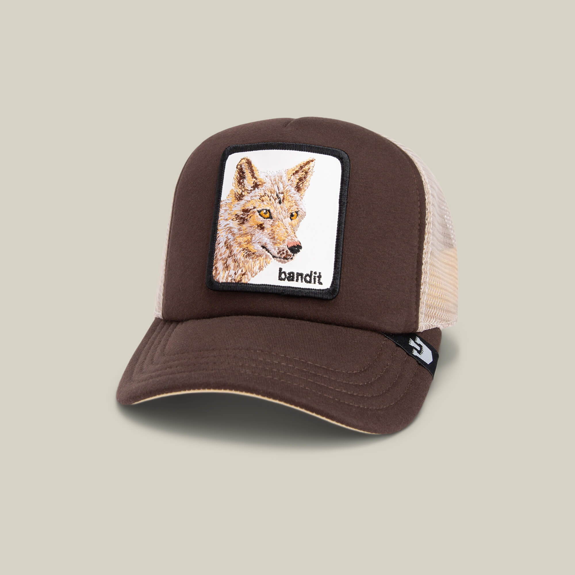 The Chaser by Goorin Bros. is a brown and beige kids cap with a front "bandit" coyote patch and a breathable mesh back for comfort.