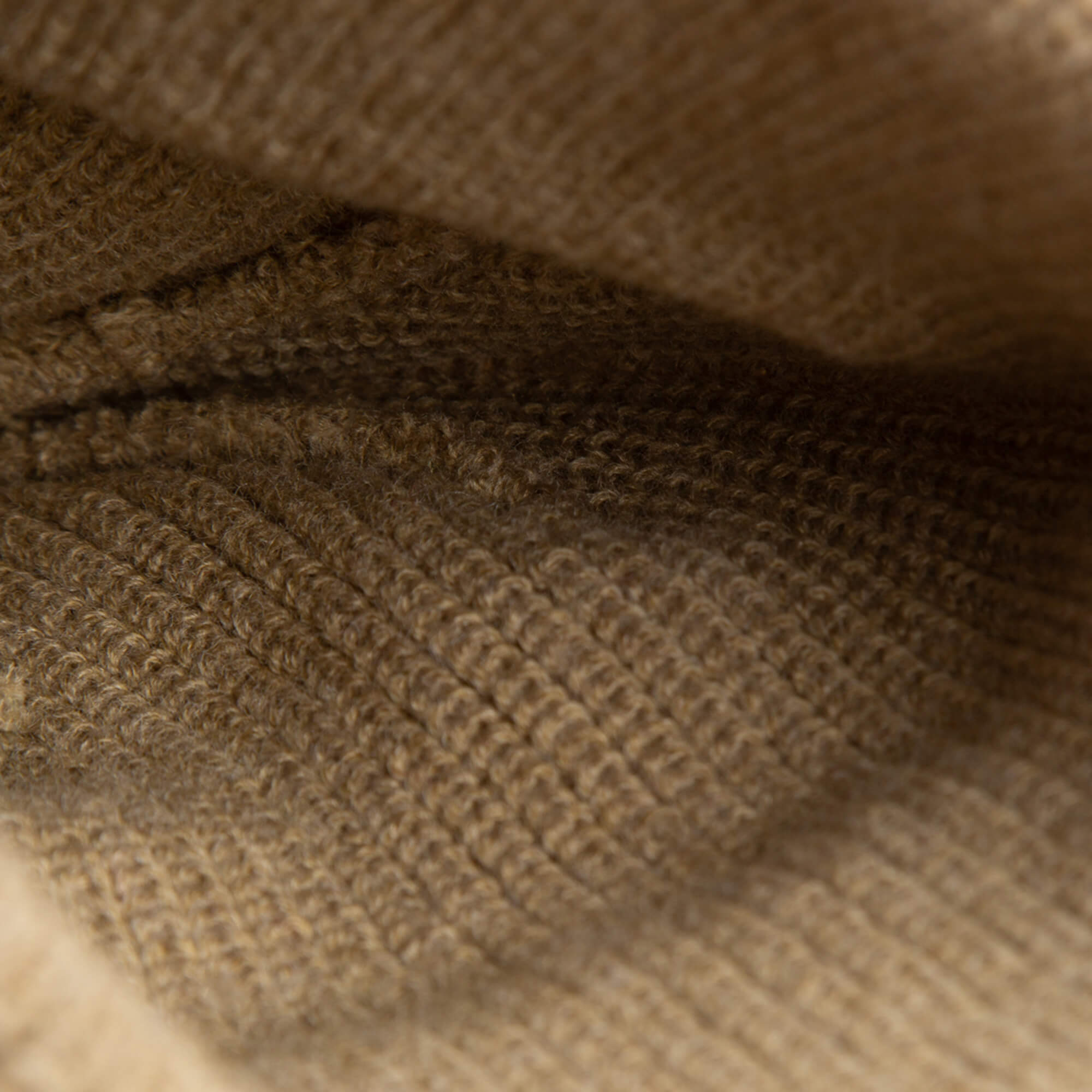 Close-up of the soft knit beige ribbed texture and stitching inside The Cuddly Beanie Mini by Goorin Bros.—perfect for a cozy kids beanie.
