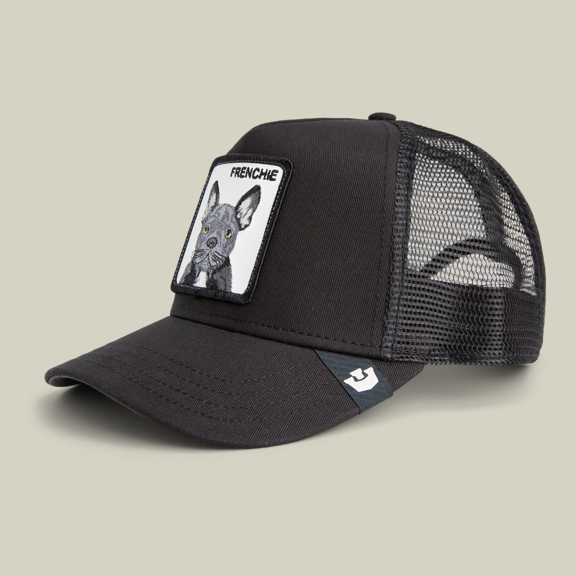 The Goorin Bros. Frenchie Trucker is a black mesh cap with a beige front patch featuring a French Bulldog illustration and the text "FRENCHIE"—a cute, bold accessory perfect for any small-dog hat enthusiast.