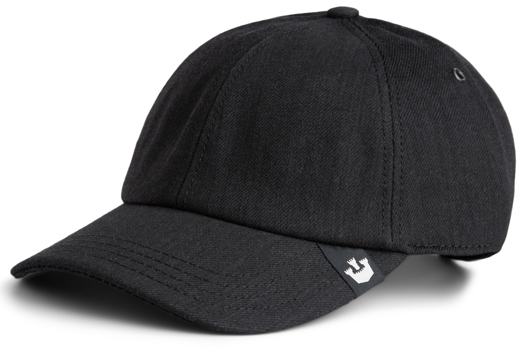 A black baseball cap with visible stitching and a small white logo tag on the brim, perfect for those who appreciate durable hats and timeless style.