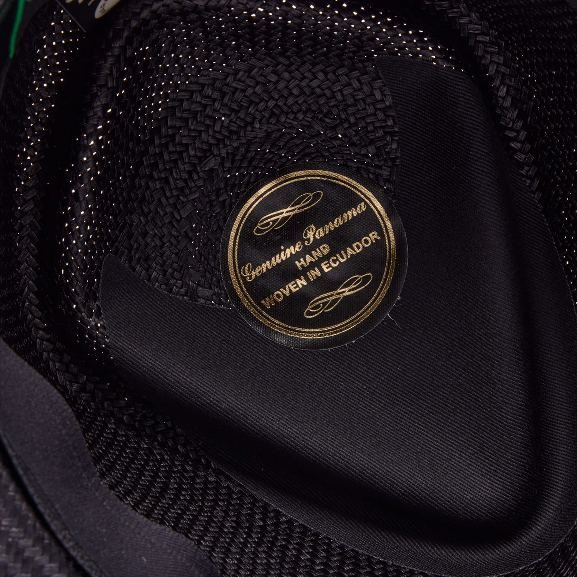 Close-up of the inner label on a Goorin Bros. That's All Folks hat, featuring gold lettering on a black background.