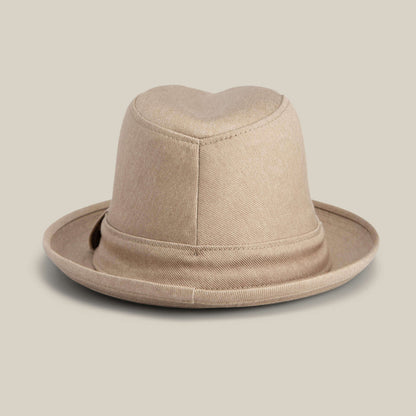 The "Big Stepper" by Goorin Bros. is a beige fedora hat with a folded brim and soft fabric texture, stylishly displayed against a plain light background.
