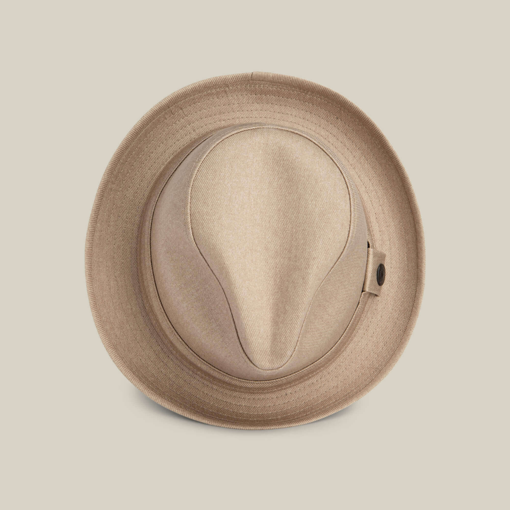 The Big Stepper by Goorin Bros. is a beige fedora hat seen from above, highlighting its crown and brim against a plain light background—a timeless accessory for elevating your style.
