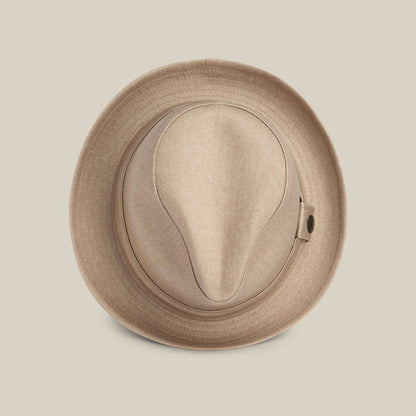 The Big Stepper by Goorin Bros. is a beige fedora hat seen from above, highlighting its crown and brim against a plain light background—a timeless accessory for elevating your style.