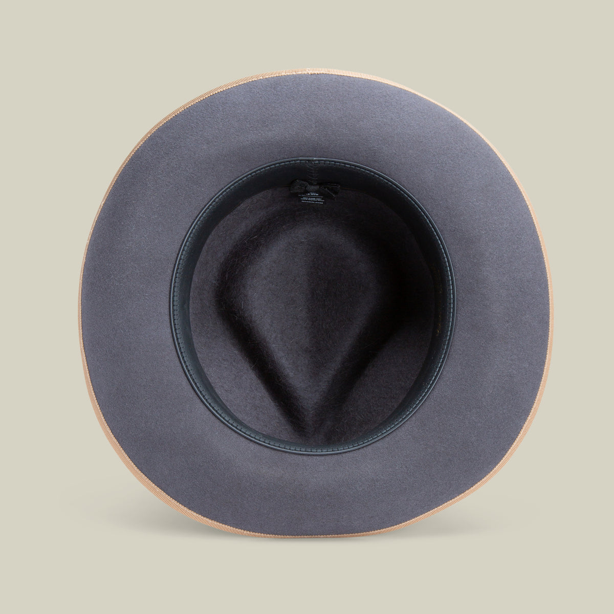 Top view of the Goorin Bros. River Gray fedora, crafted from gray merino wool with a wide brim and tan edge, photographed against a neutral background.