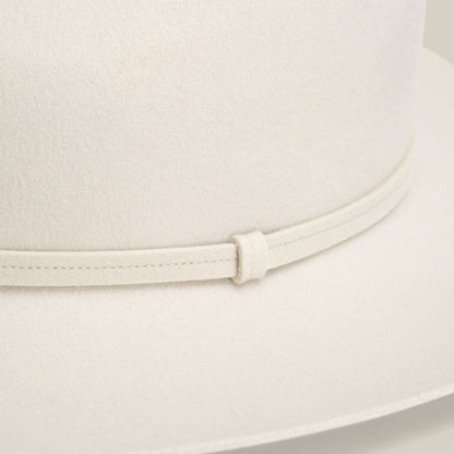 Close-up of the Goorin Bros. Night Hawk fedora in light beige, featuring a teardrop crown, matching thin band, and wide snap brim for versatile all-season style.